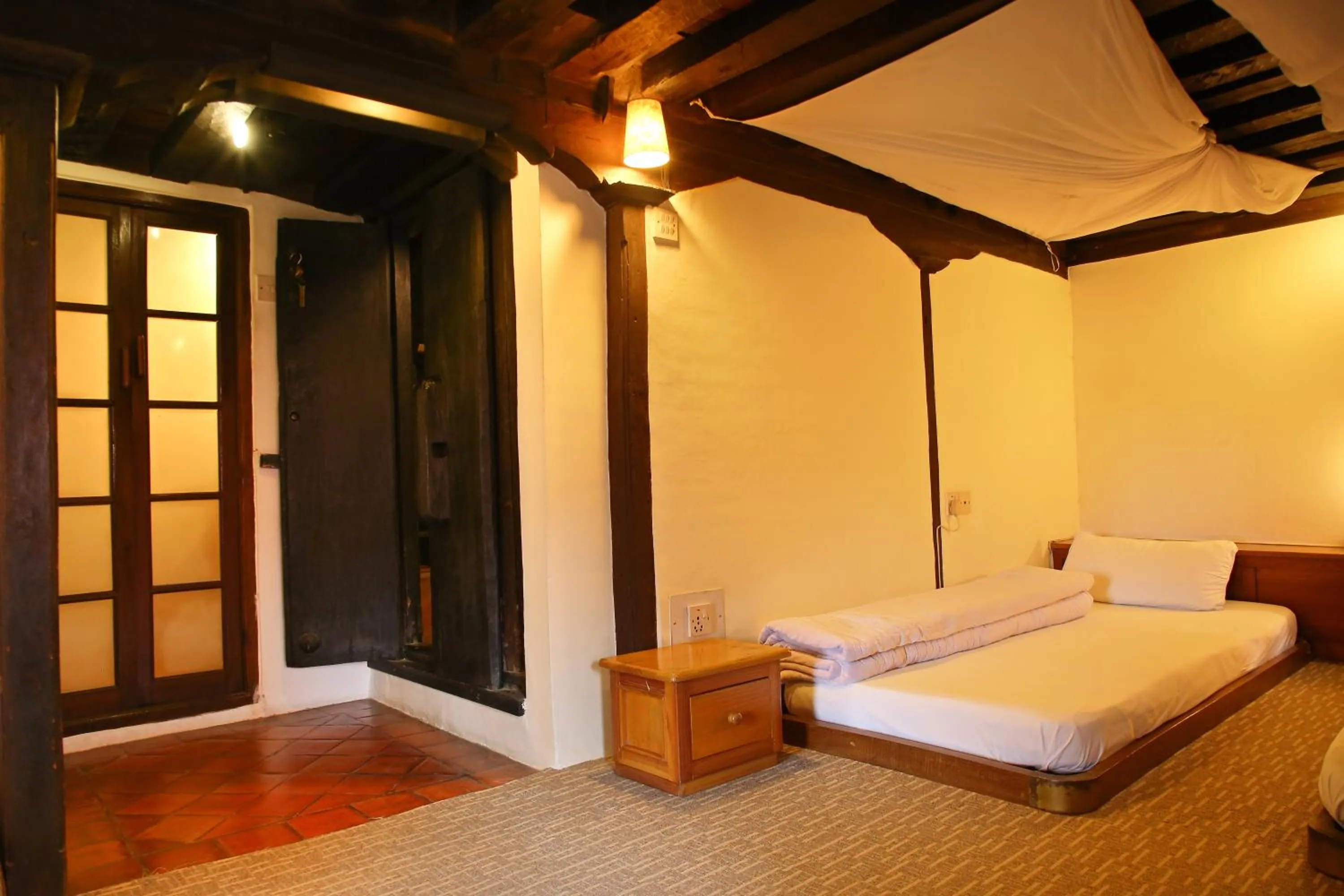 Bed in Newa Chen Historic House UNESCO