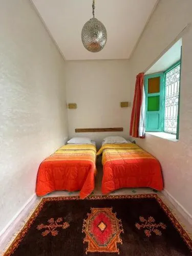 Bed in Riad Deux Palmiers