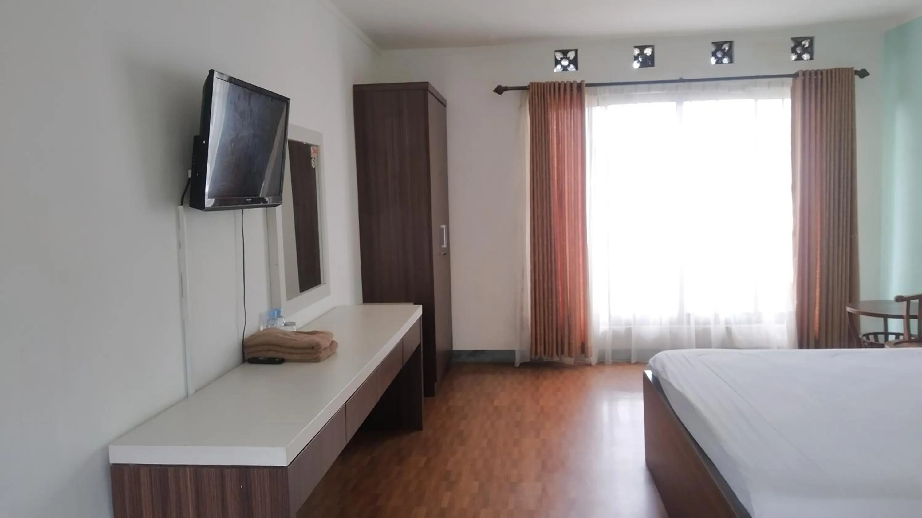 Bed in PUNCAK VILLAGE HOTEL & KAMPUNG MAIN ANAK