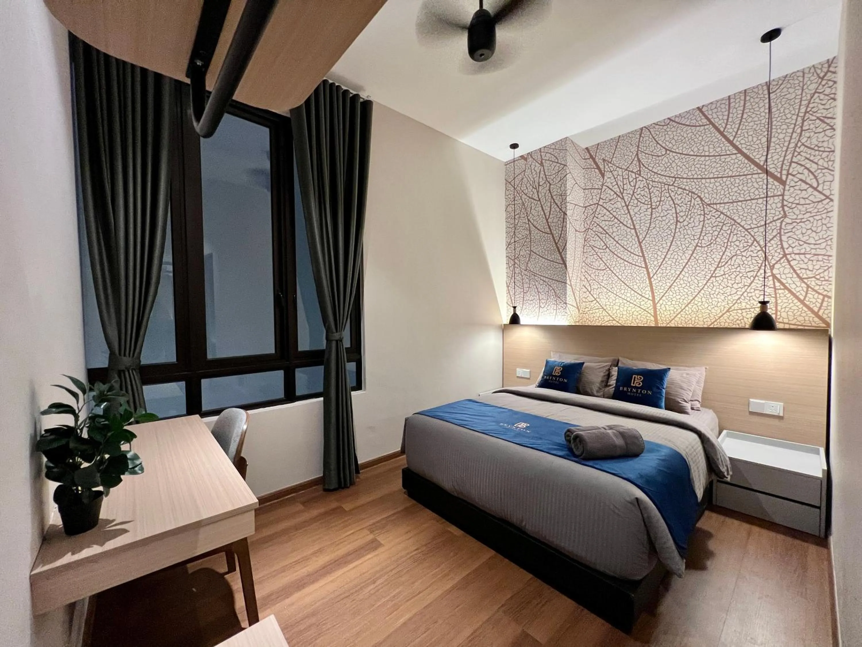 Bed in Hotel Brynton at Cameron Centrum Mall