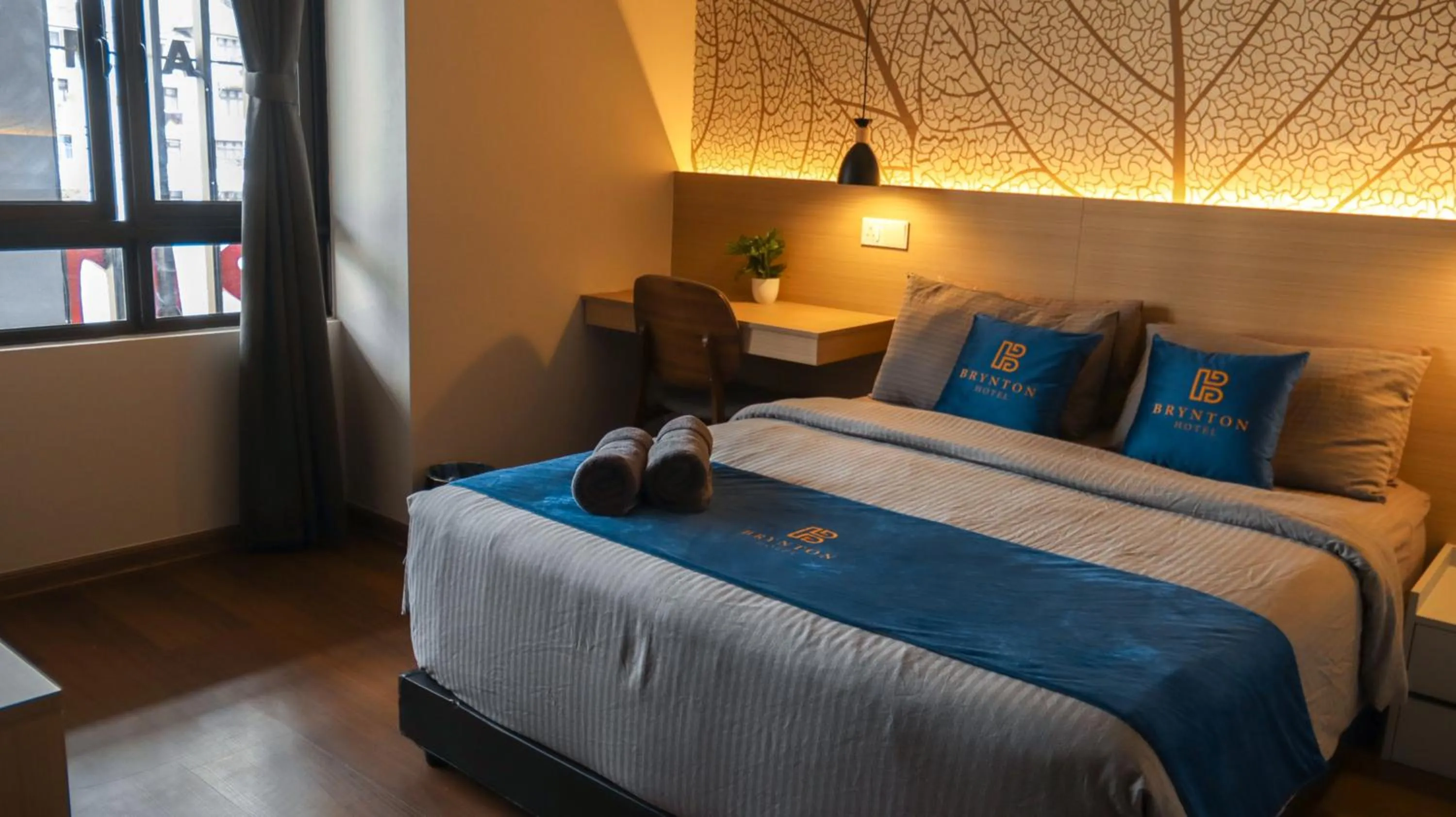 Bed in Hotel Brynton at Cameron Centrum Mall