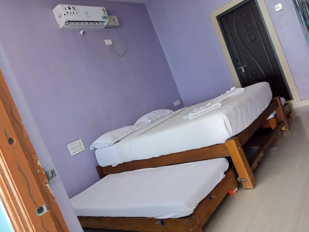 Bed in Poornima Beach Stay