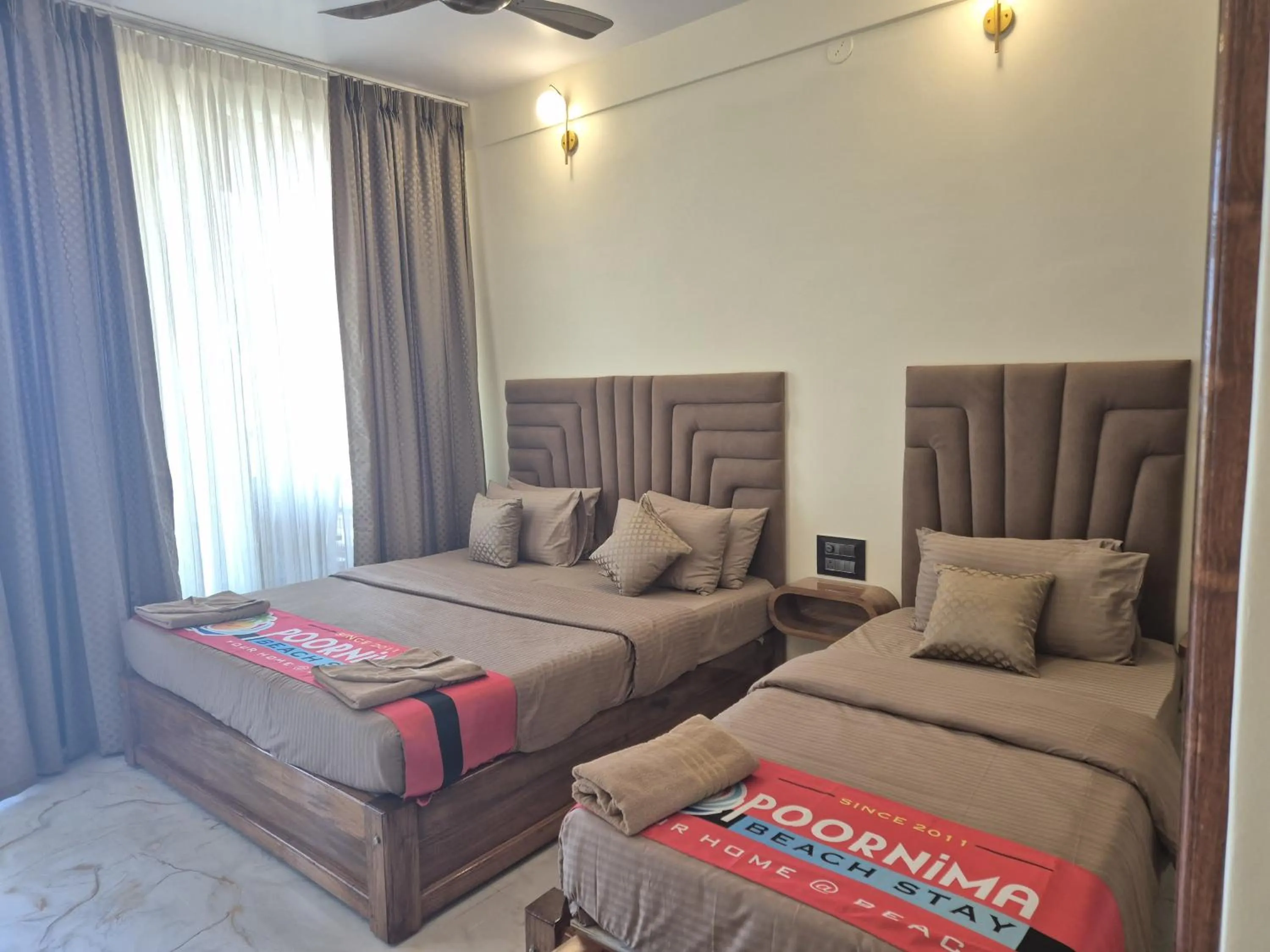 Bed in Poornima Beach Stay