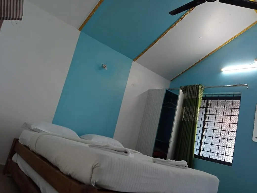 Bed in Poornima Beach Stay