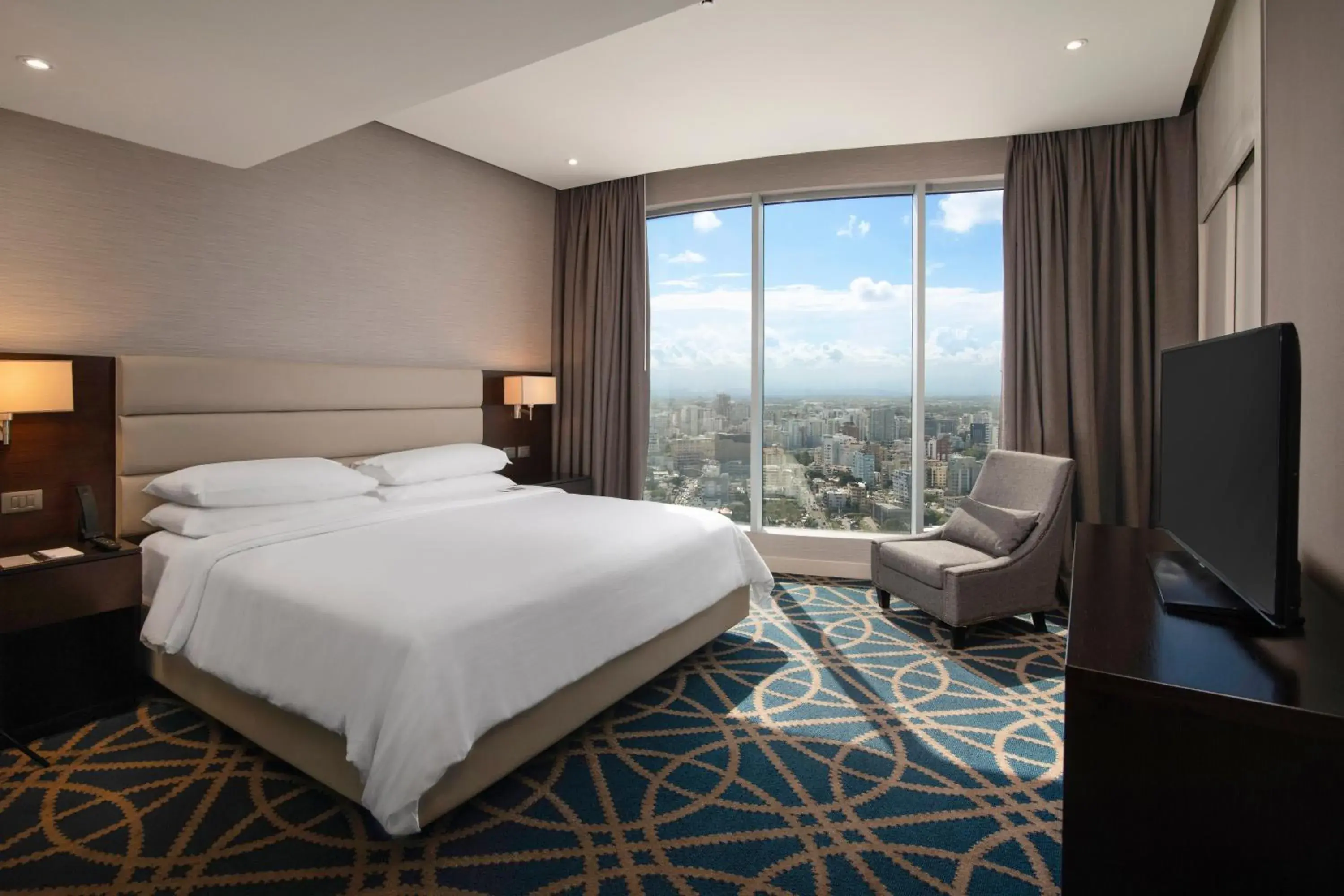 TV and multimedia, Bed in Embassy Suites by Hilton Santo Domingo TV and multimedia, Bed in Embassy Suites by Hilton Santo Domingo