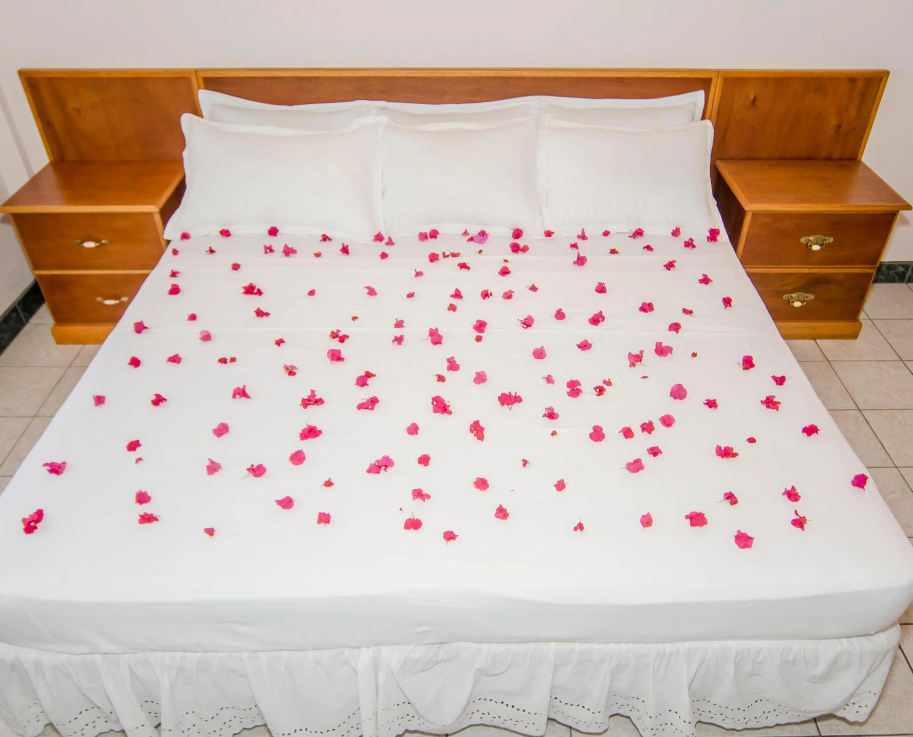 Bed in Caribbean Inn and Suites
