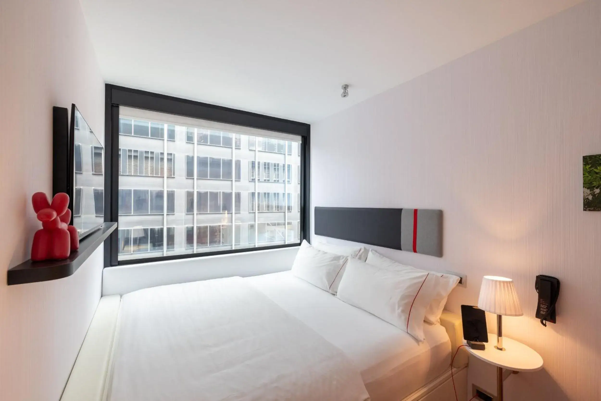 Property building, Bed in citizenM New York Times Square Property building, Bed in citizenM New York Times Square