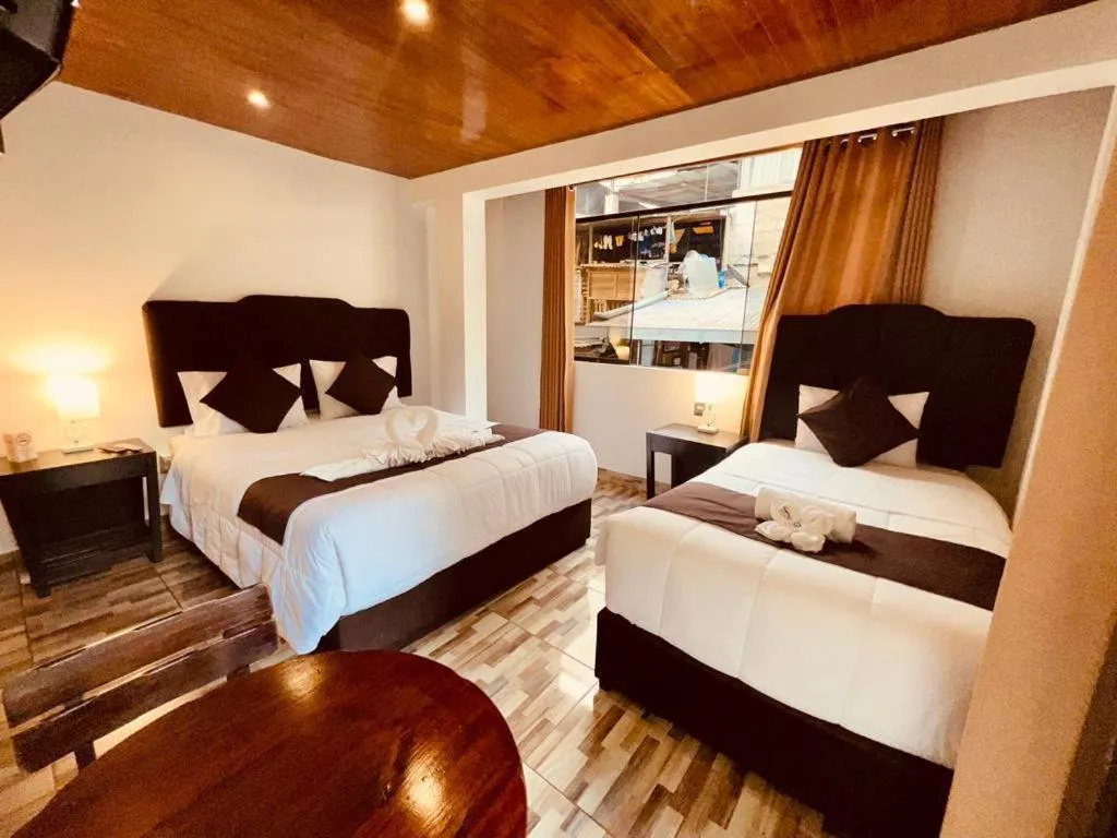 Bed in SAYACMARCA CLASSIC Inn