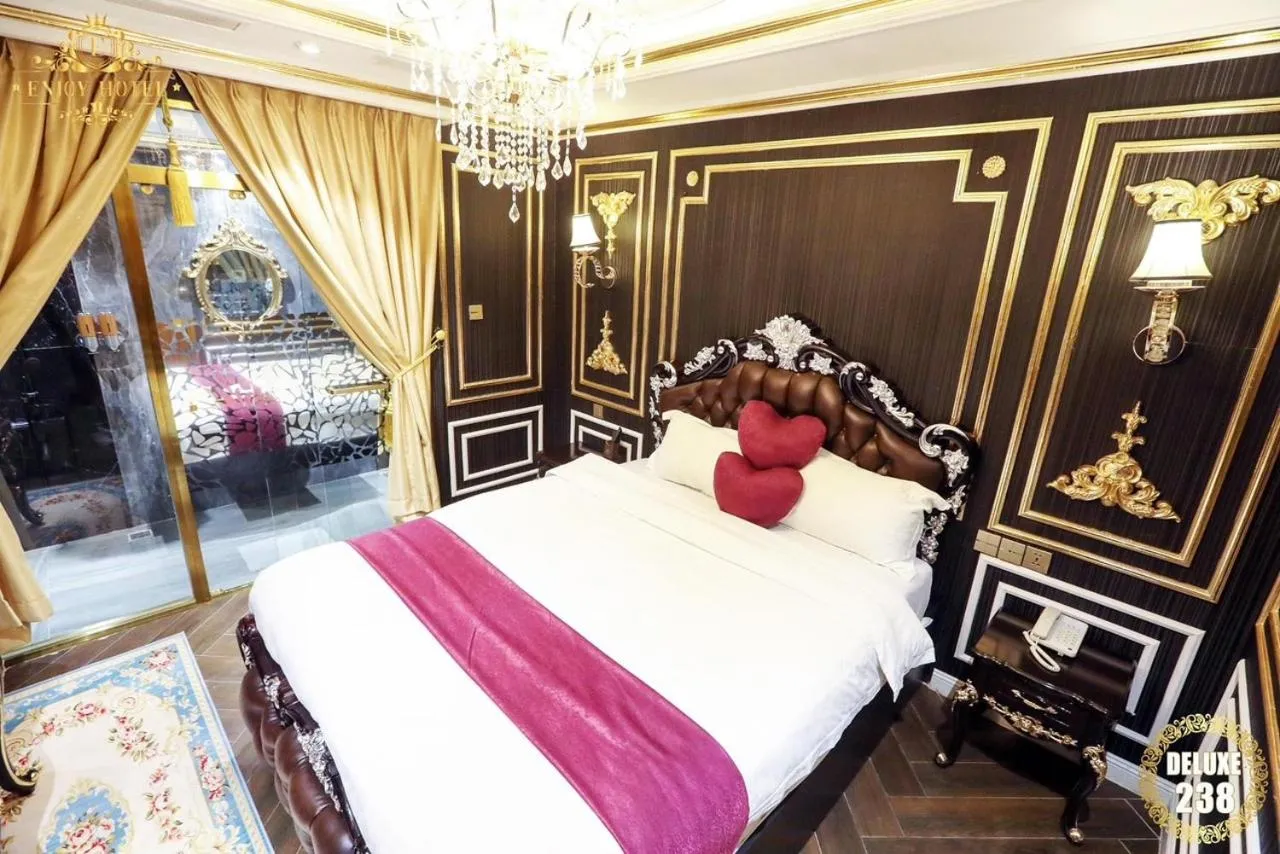 Bed in Enjoy Boutique Saigon Hotel