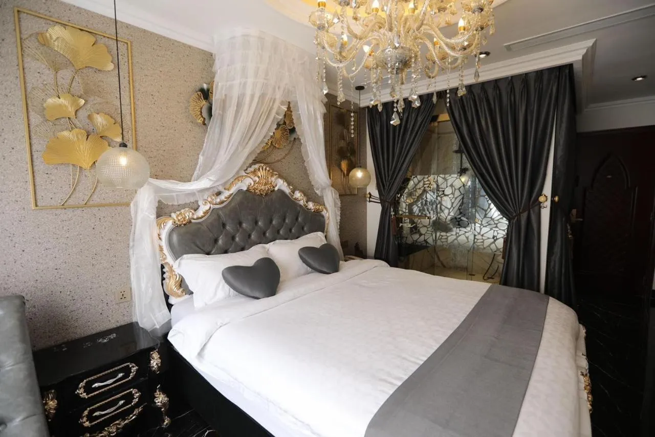 Bed in Enjoy Boutique Saigon Hotel