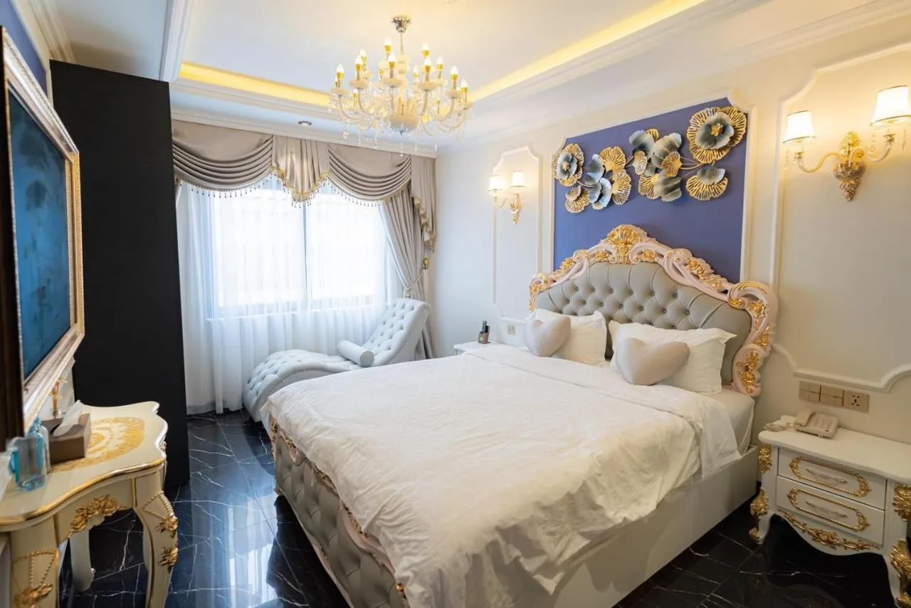 Bed in Enjoy Boutique Saigon Hotel