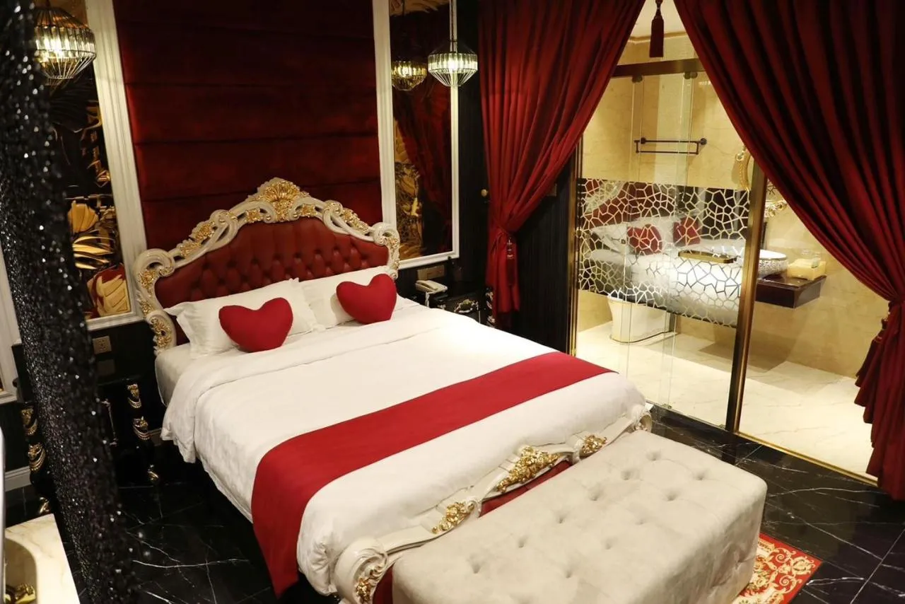 Bed in Enjoy Boutique Saigon Hotel