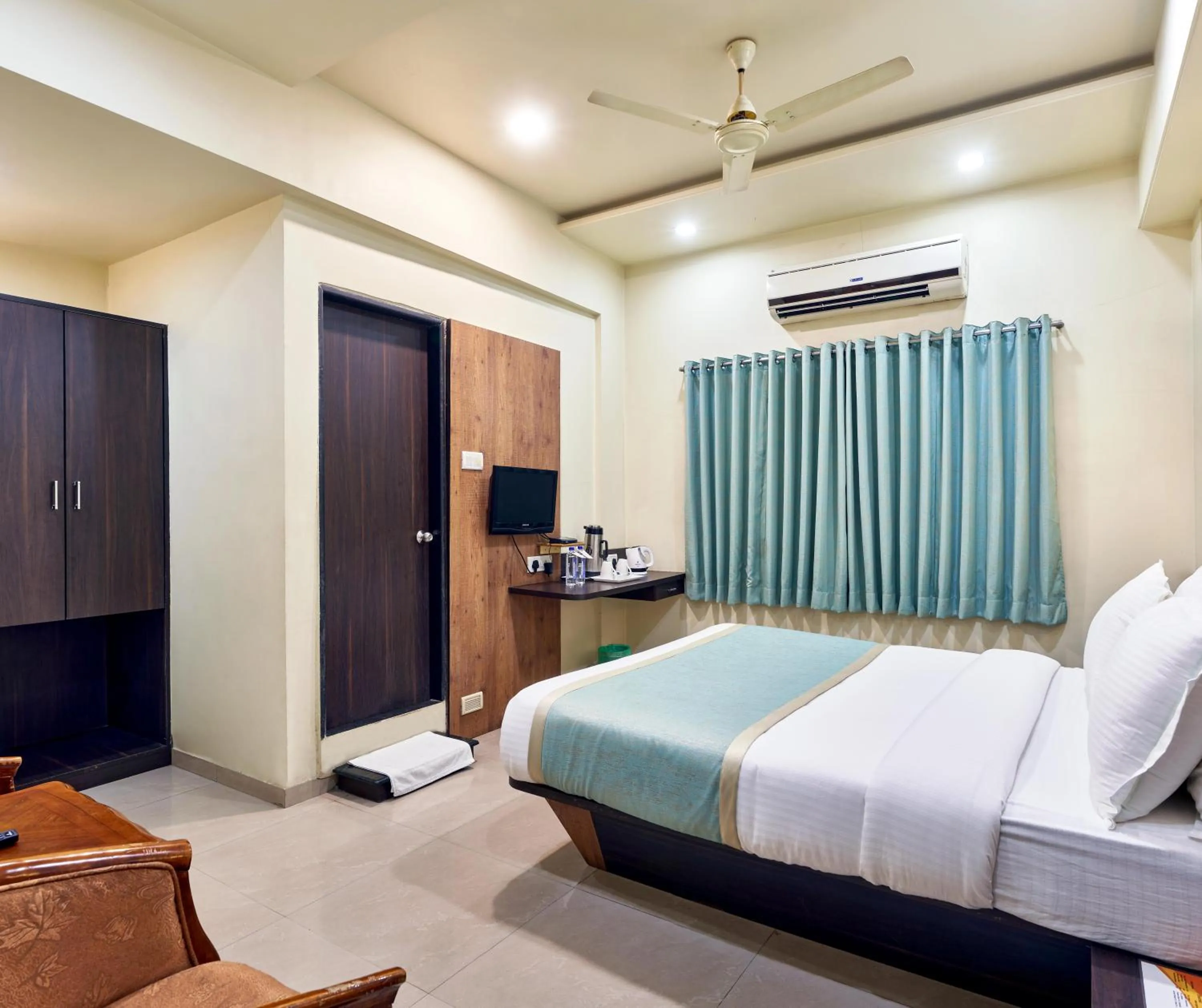 Photo of the whole room, Bed in Hotel Atria, Kolhapur