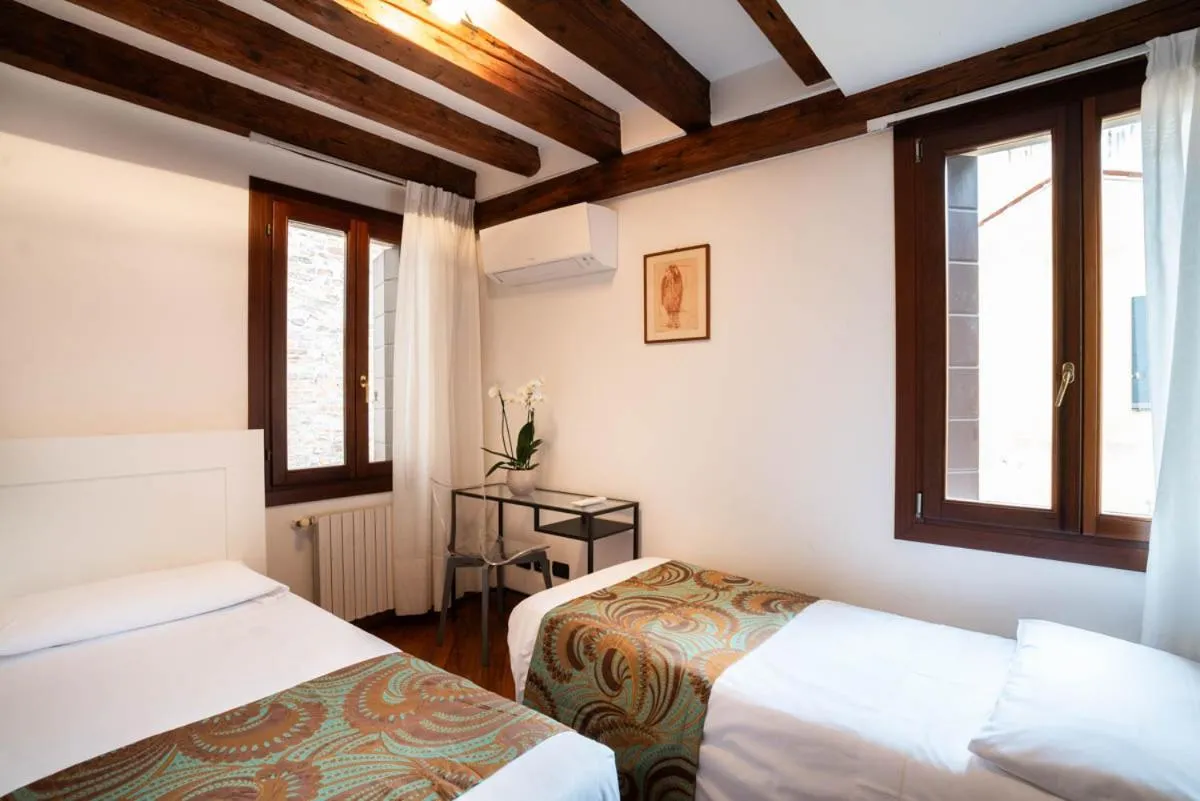 Bed in Salmaso Apartments