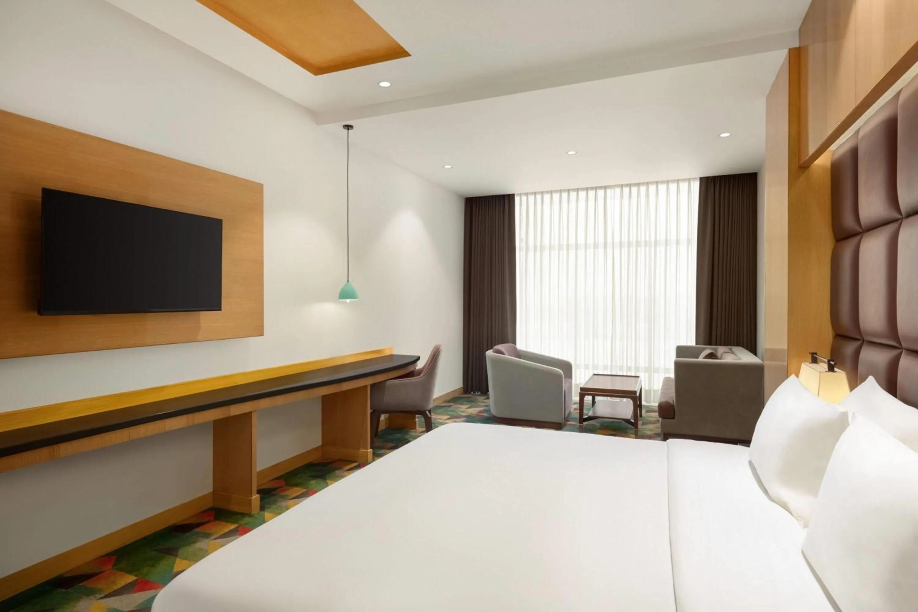 Photo of the whole room, Bed in Ramada Plaza by Wyndham Jammu Vijaypur