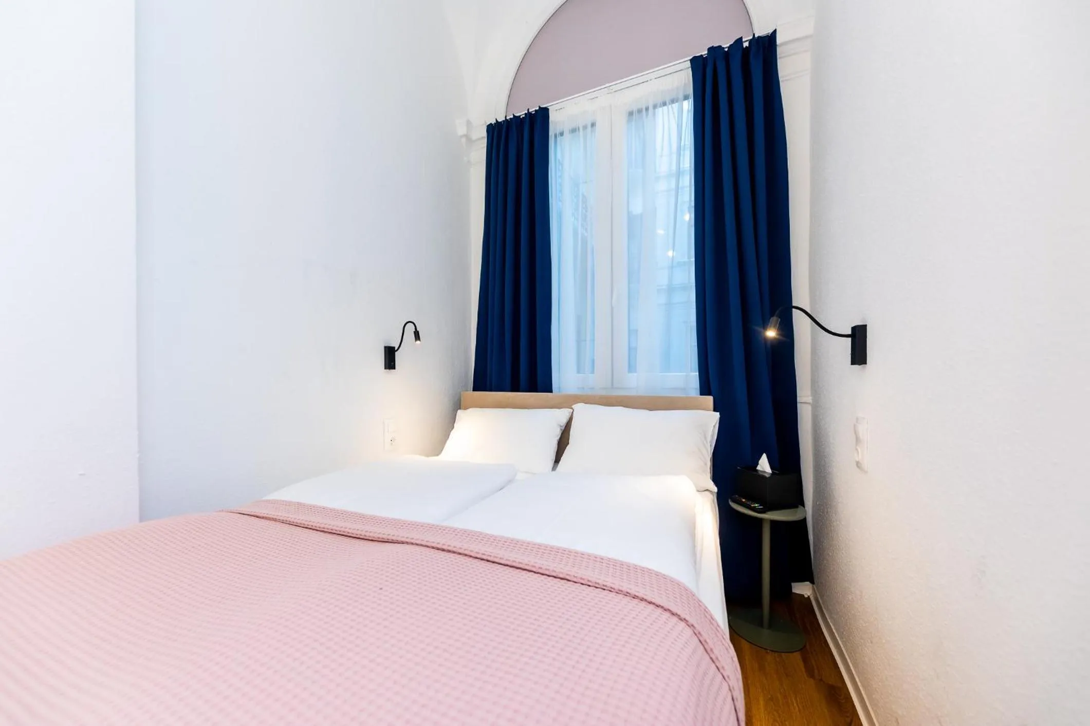 Bed in Adagio Downtown Rooms