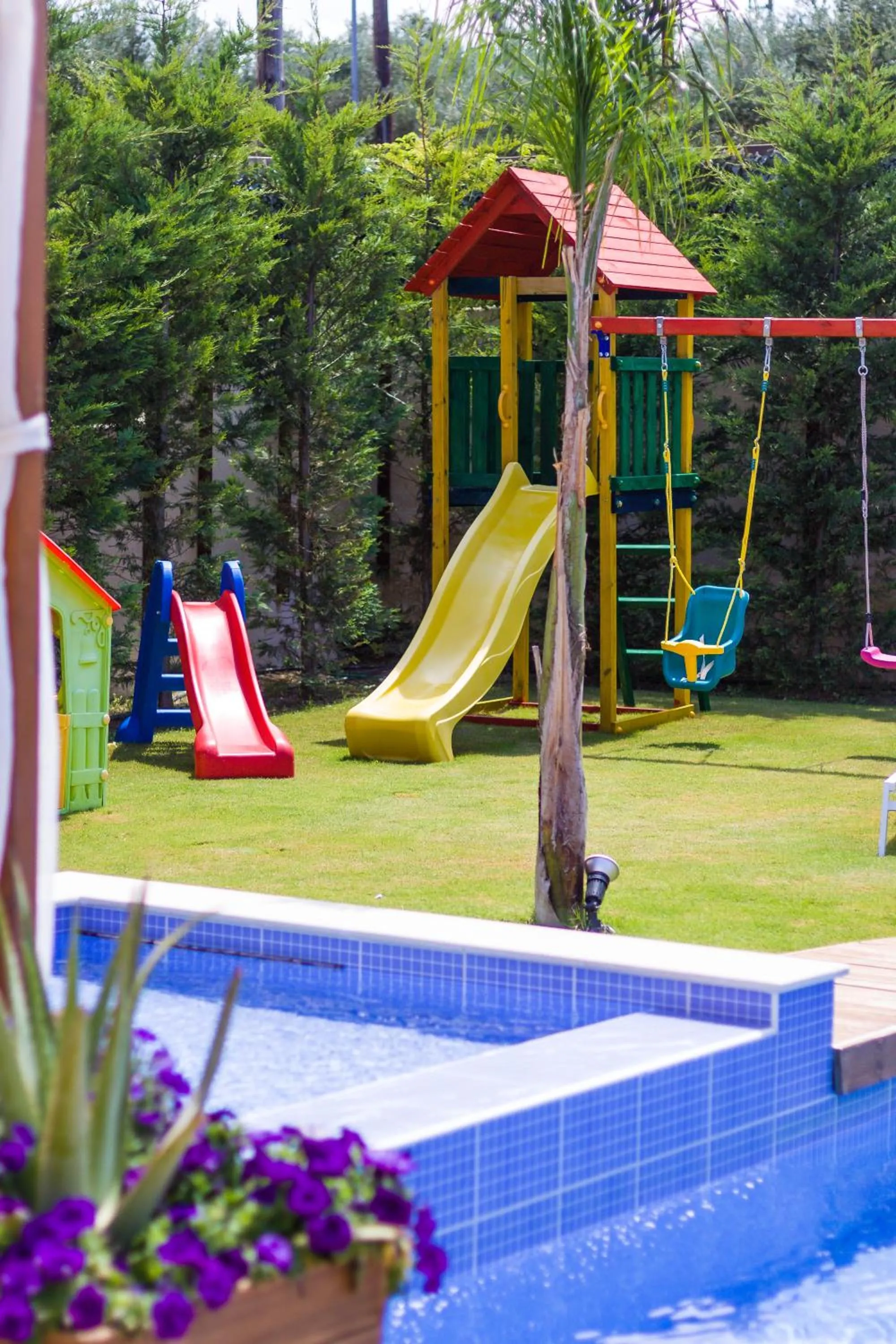 Children play ground in Eva & Dimitrios Villas, Captivating Oasis with Pools & BBQ, By ThinkVilla