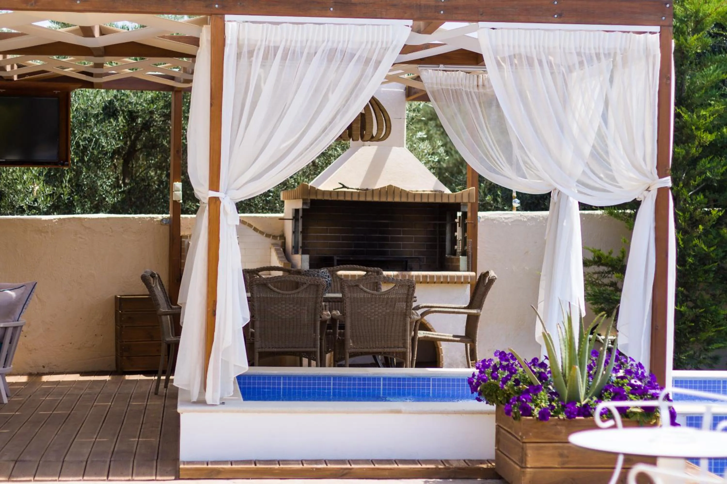Patio in Eva & Dimitrios Villas, Captivating Oasis with Pools & BBQ, By ThinkVilla