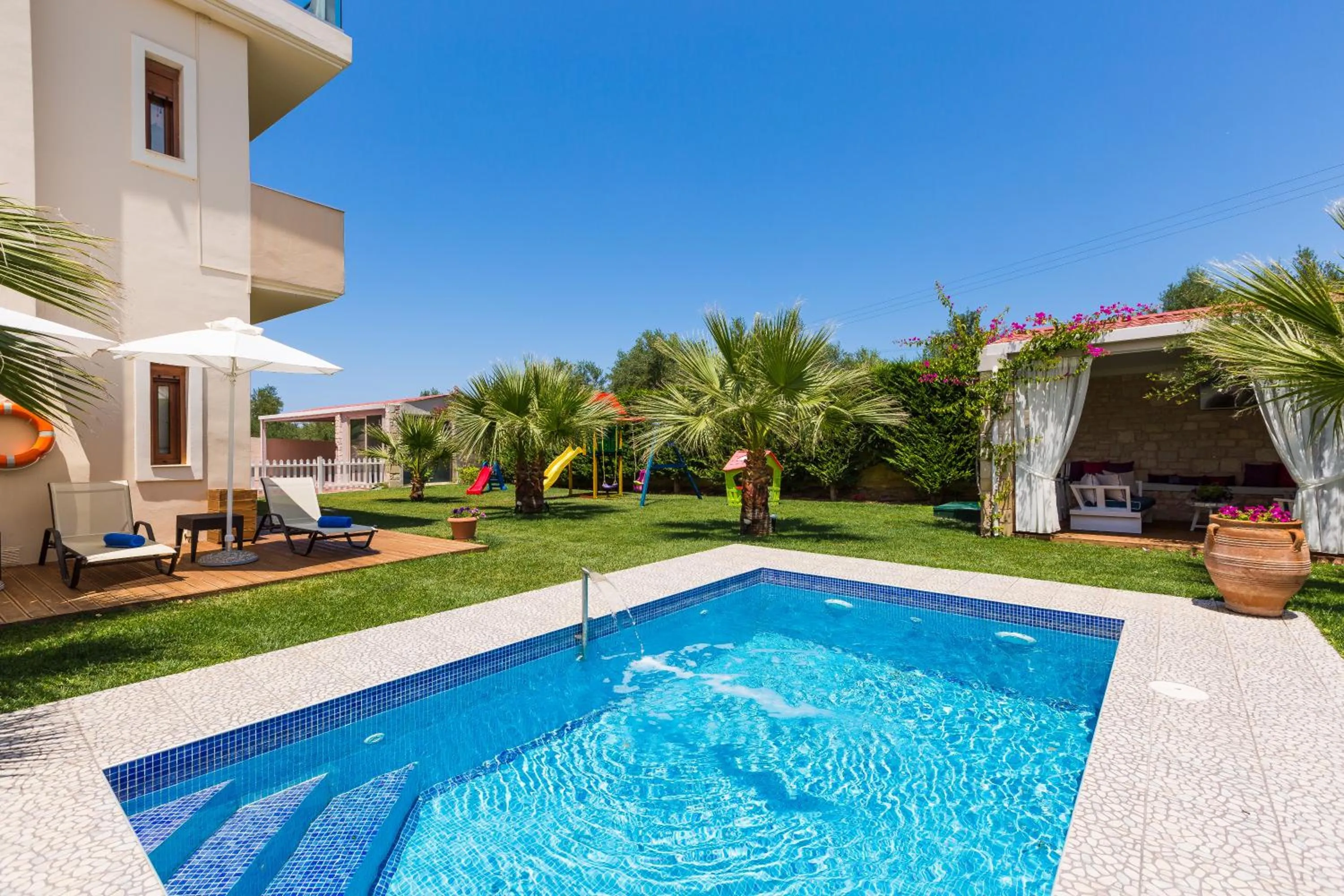 Property building in Eva & Dimitrios Villas, Captivating Oasis with Pools & BBQ, By ThinkVilla