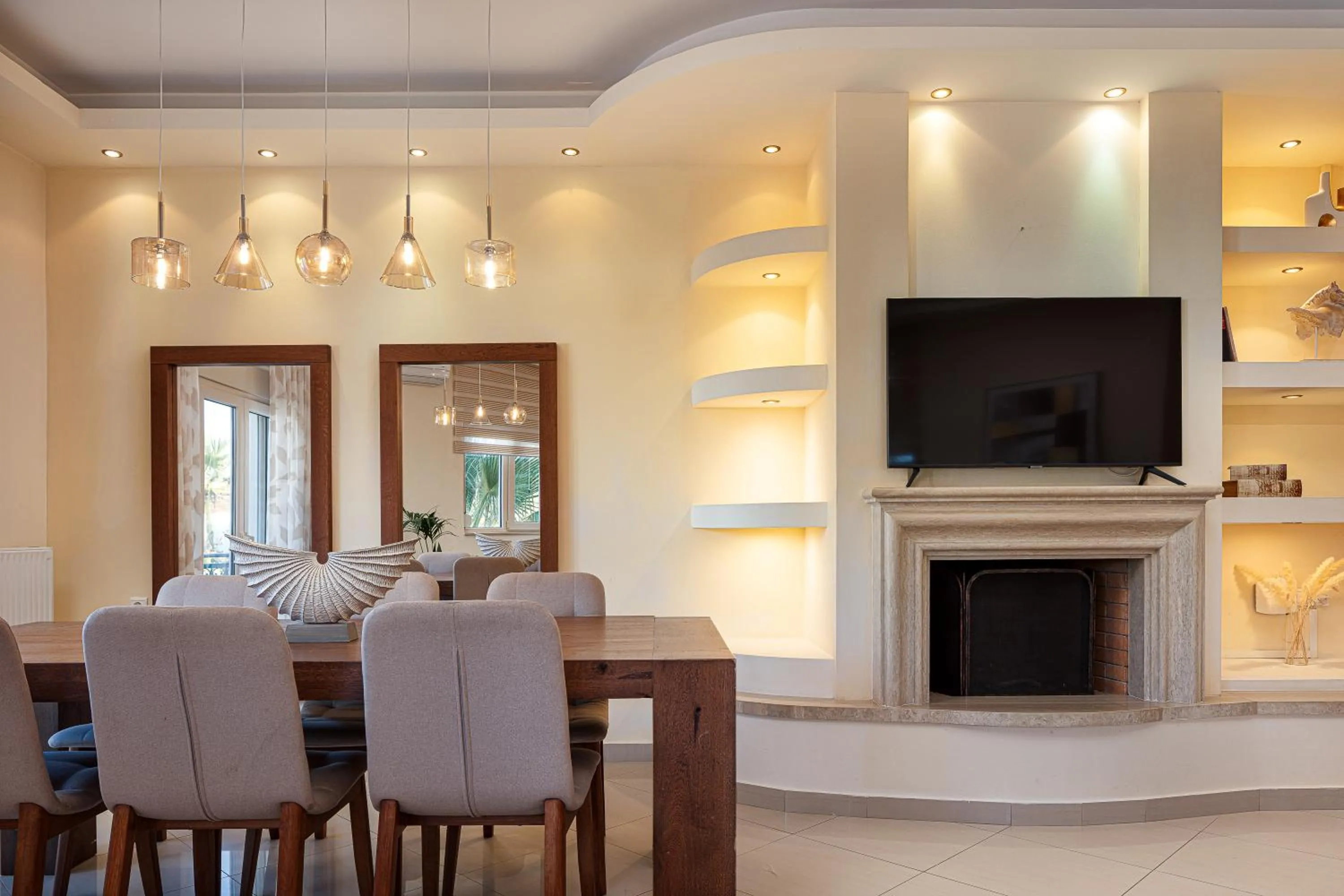 Communal lounge/ TV room in Eva & Dimitrios Villas, Captivating Oasis with Pools & BBQ, By ThinkVilla