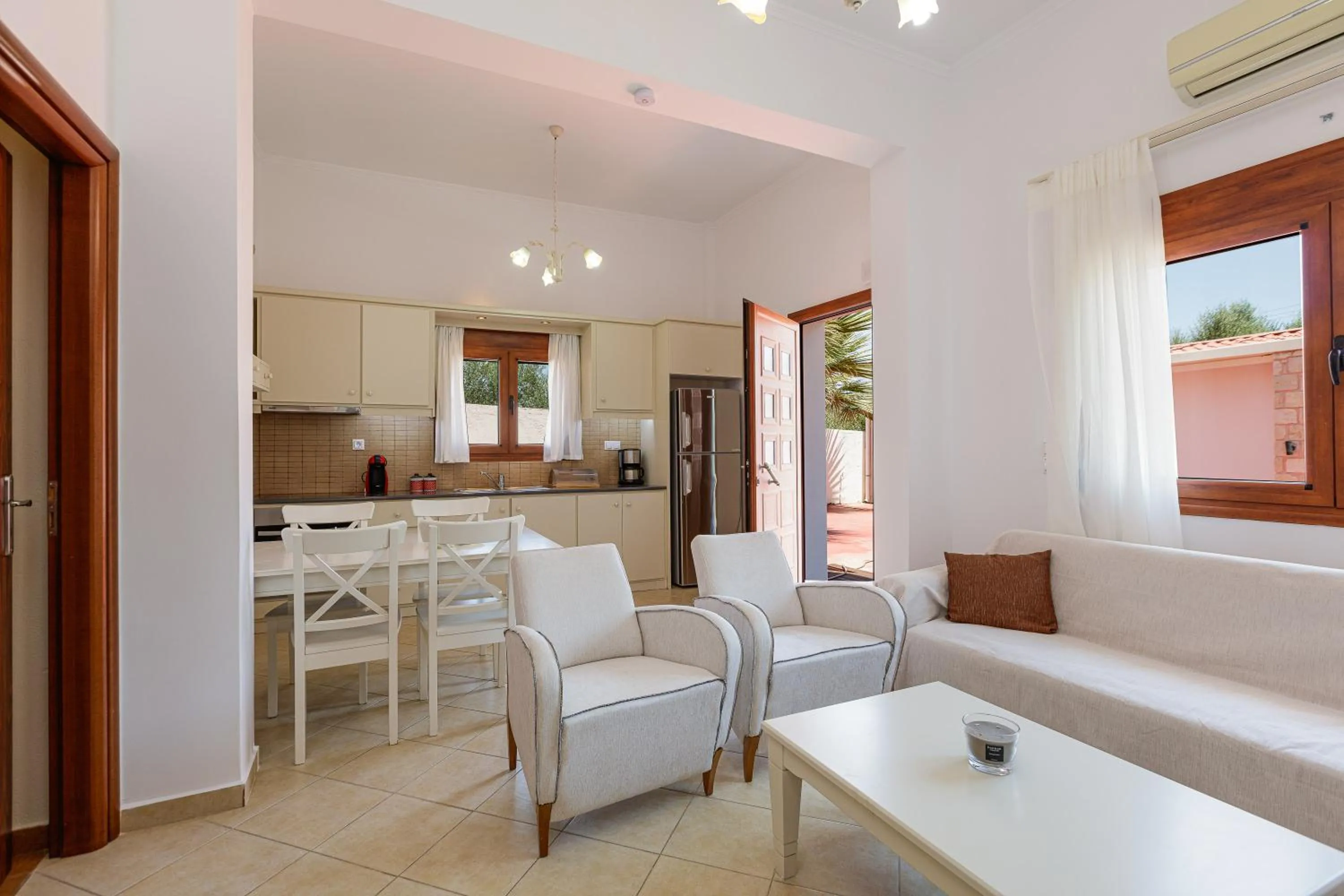 Living room in Eva & Dimitrios Villas, Captivating Oasis with Pools & BBQ, By ThinkVilla