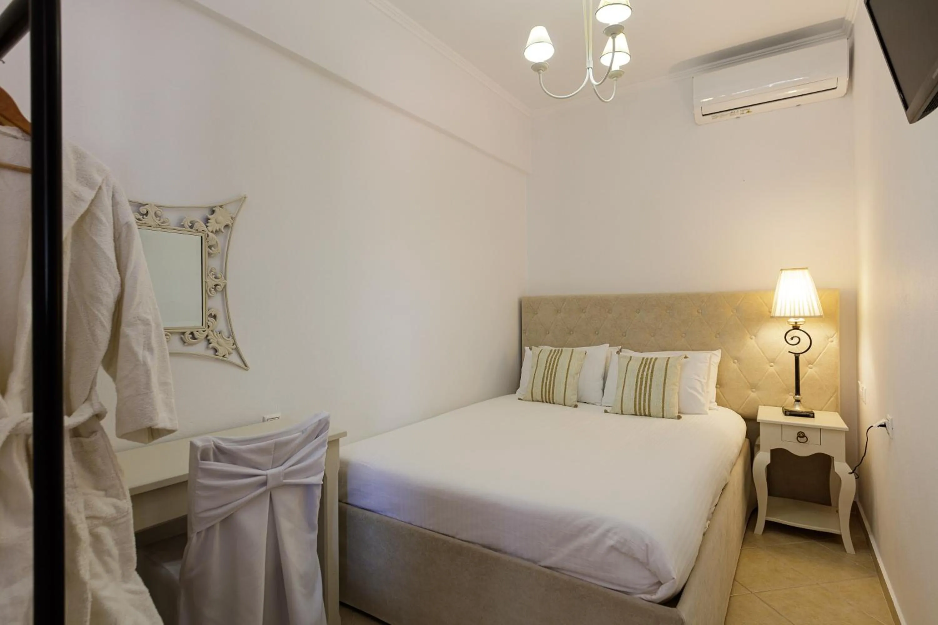 Bed in Eva & Dimitrios Villas, Captivating Oasis with Pools & BBQ, By ThinkVilla