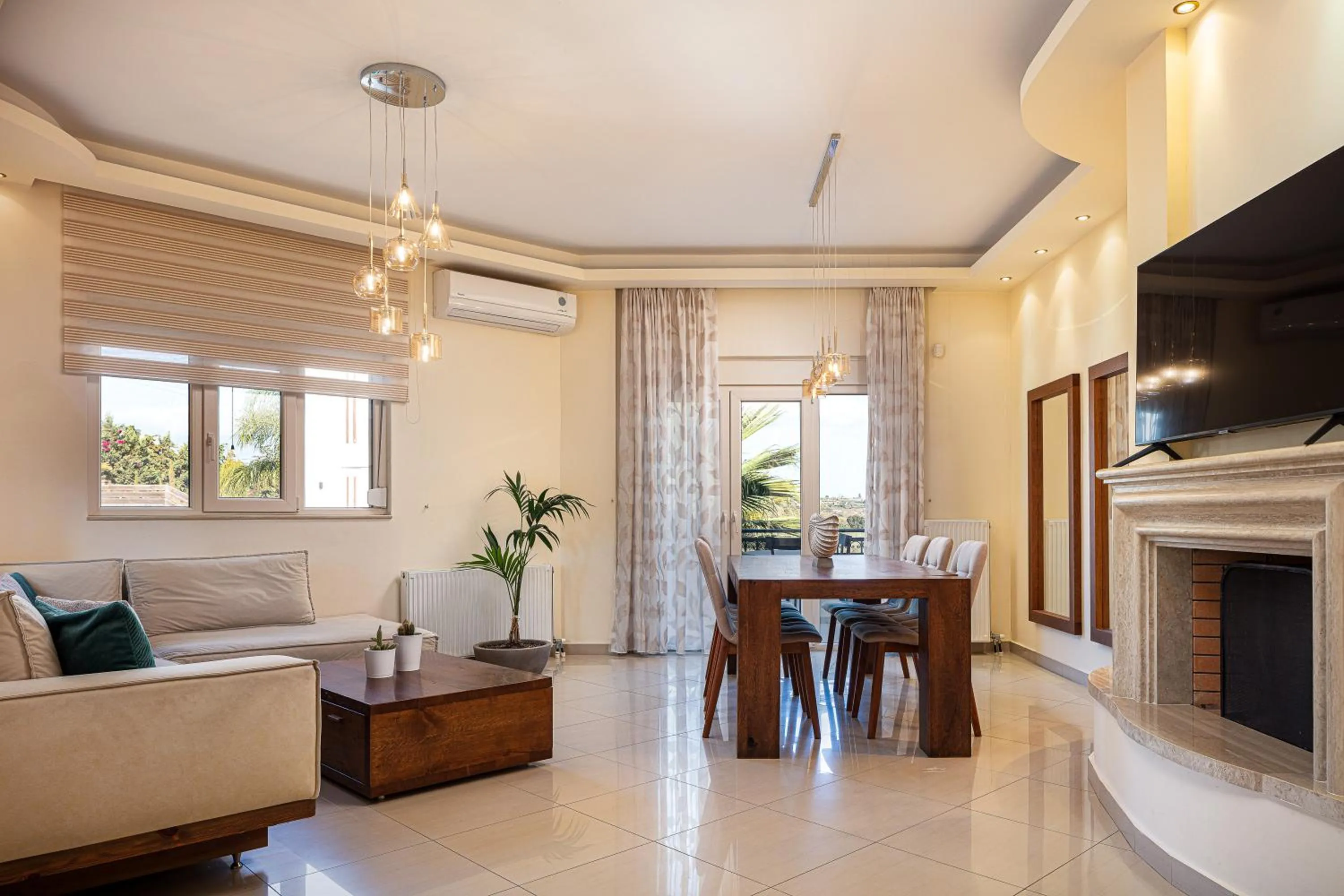 Communal lounge/ TV room in Eva & Dimitrios Villas, Captivating Oasis with Pools & BBQ, By ThinkVilla