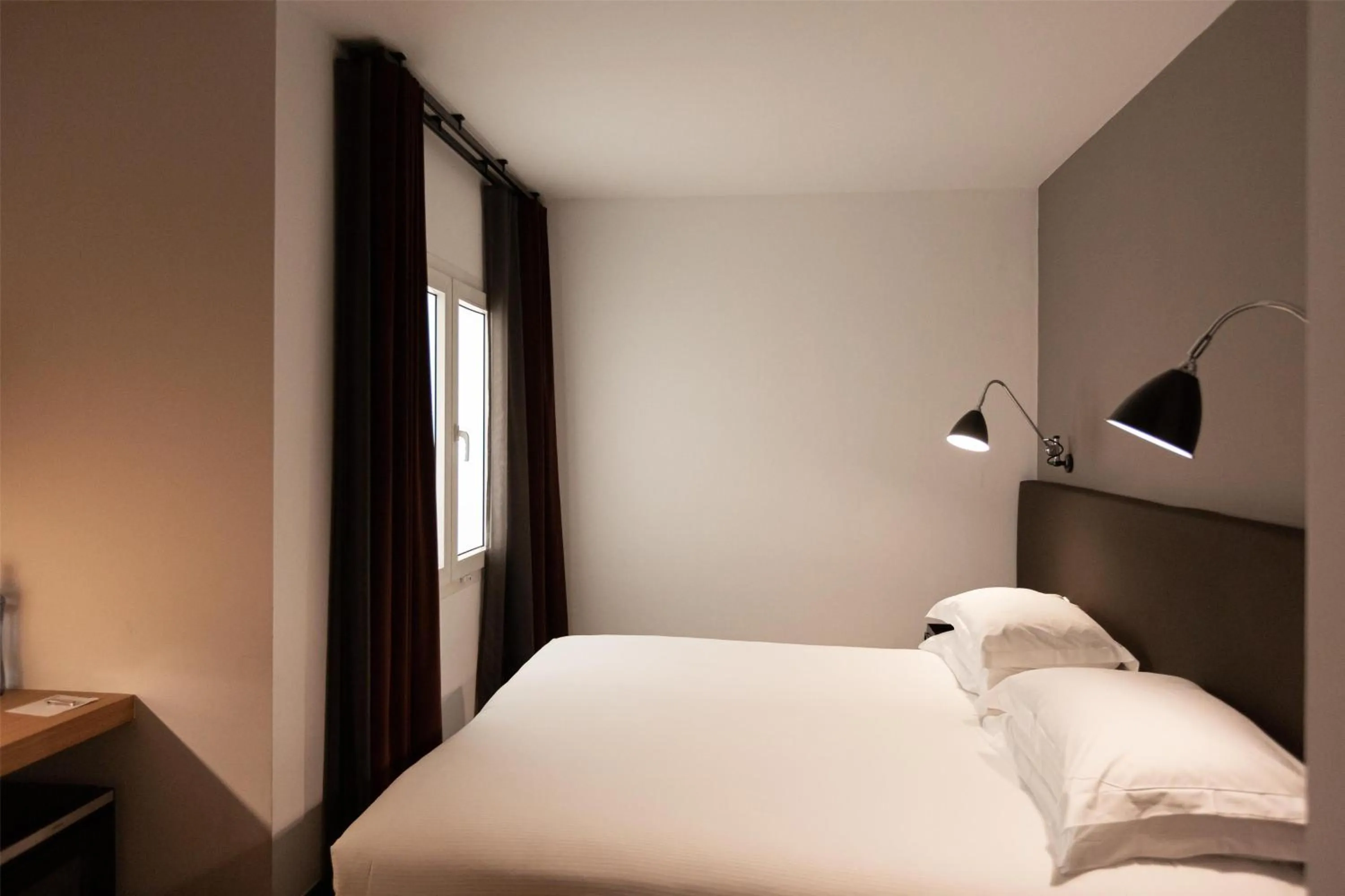 Bed in Alexandra Barcelona Hotel, Curio Collection by Hilton