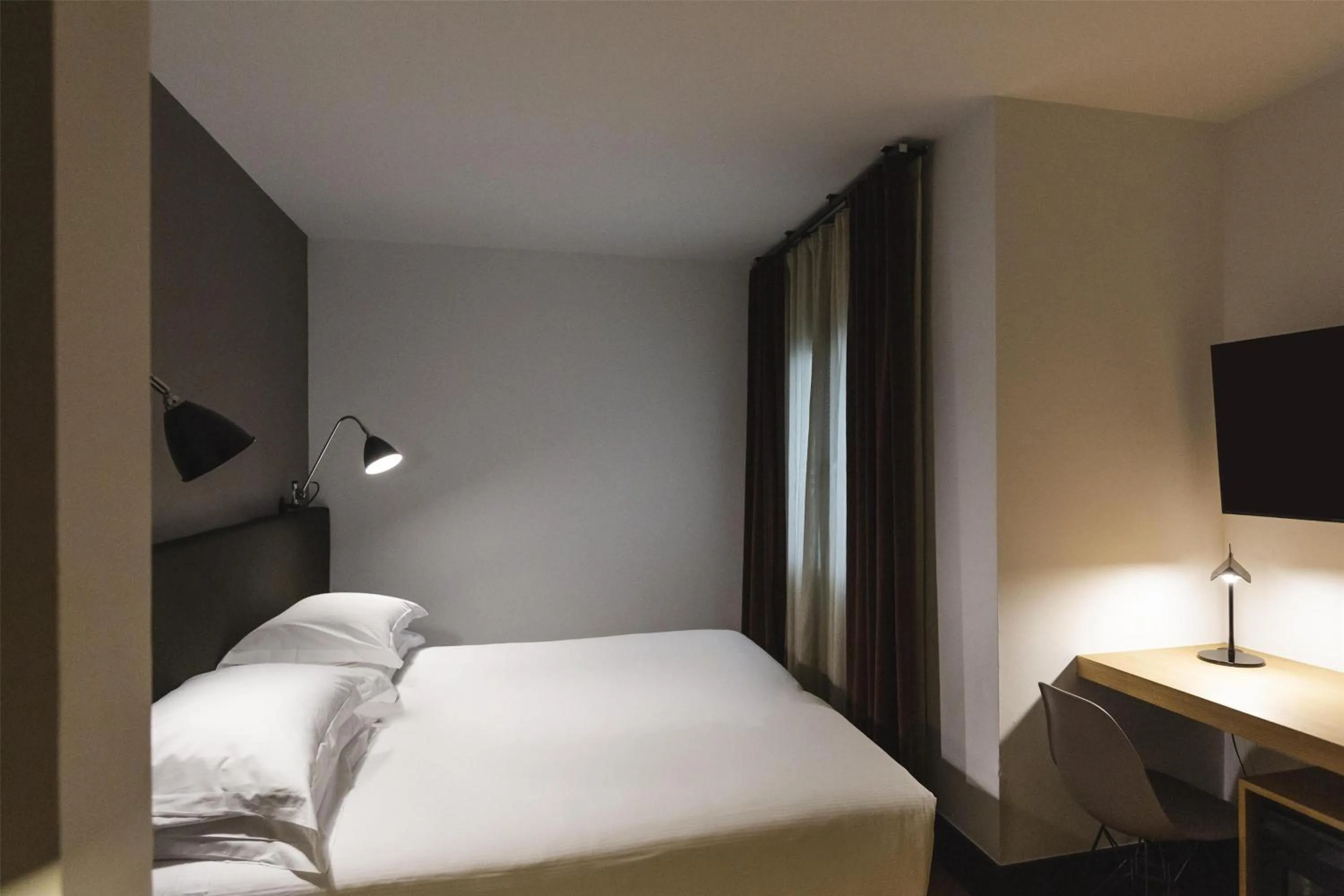 Bed in Alexandra Barcelona Hotel, Curio Collection by Hilton