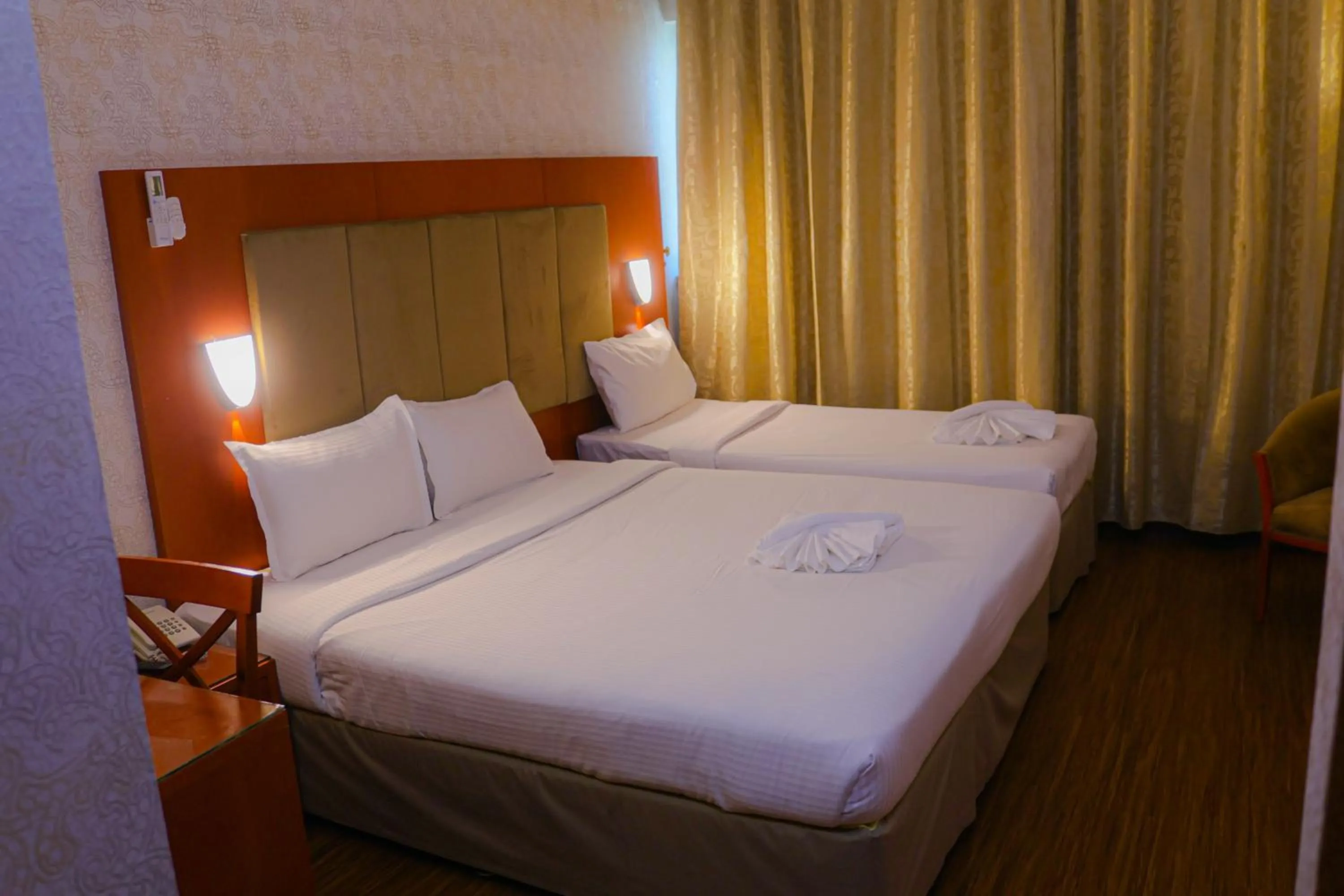 Bed in BOONMAX Hotel