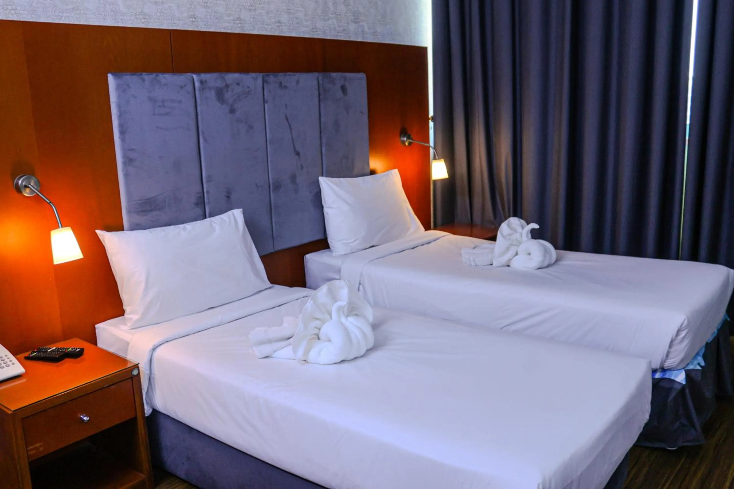 Bed in BOONMAX Hotel