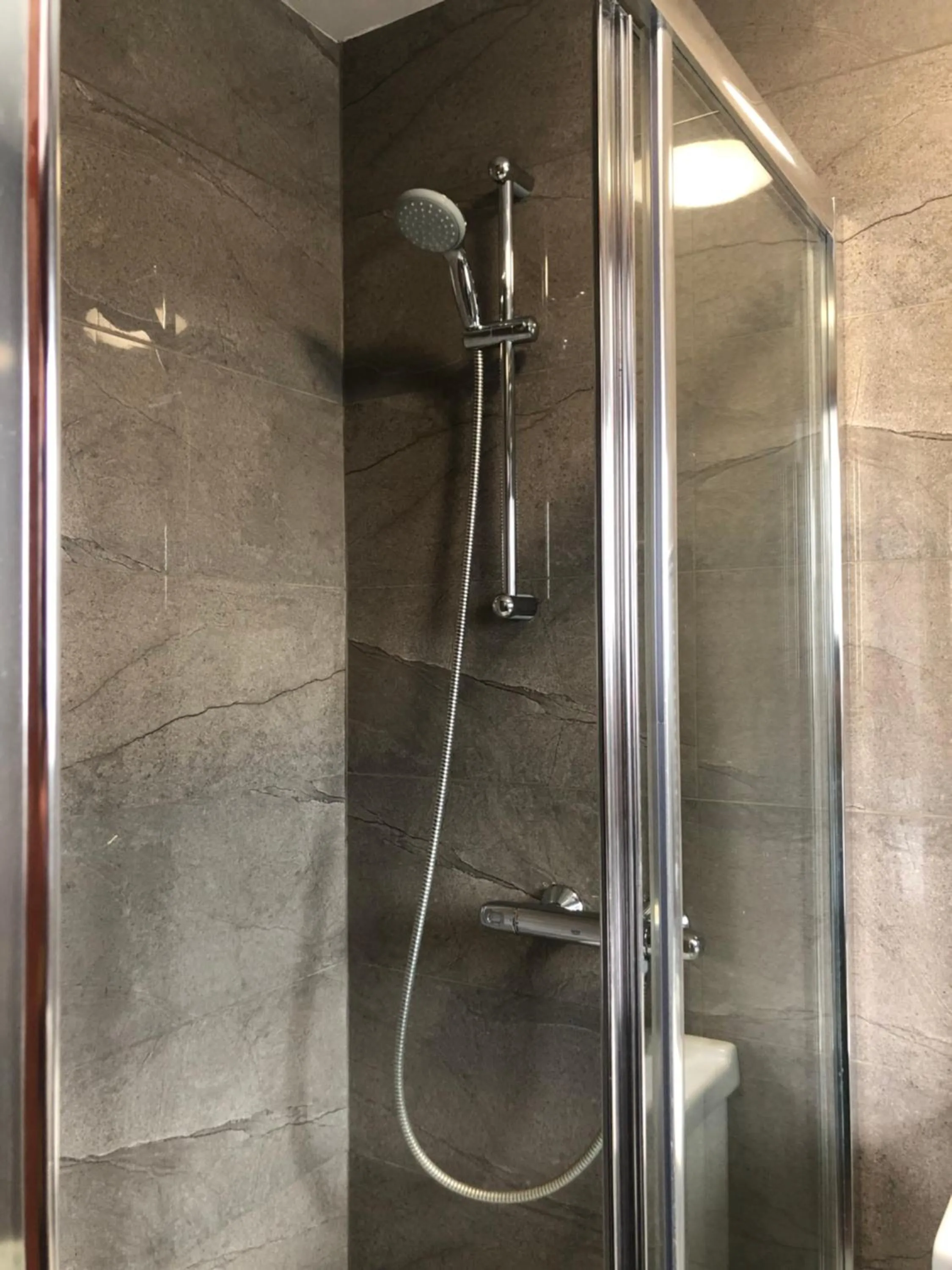Shower in Lyttleton Guest House Limited