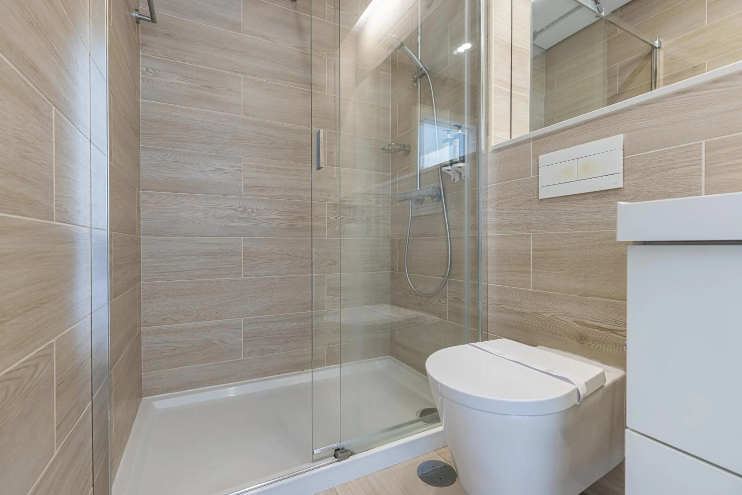 Bathroom in Garcia 28 by LovelyStay