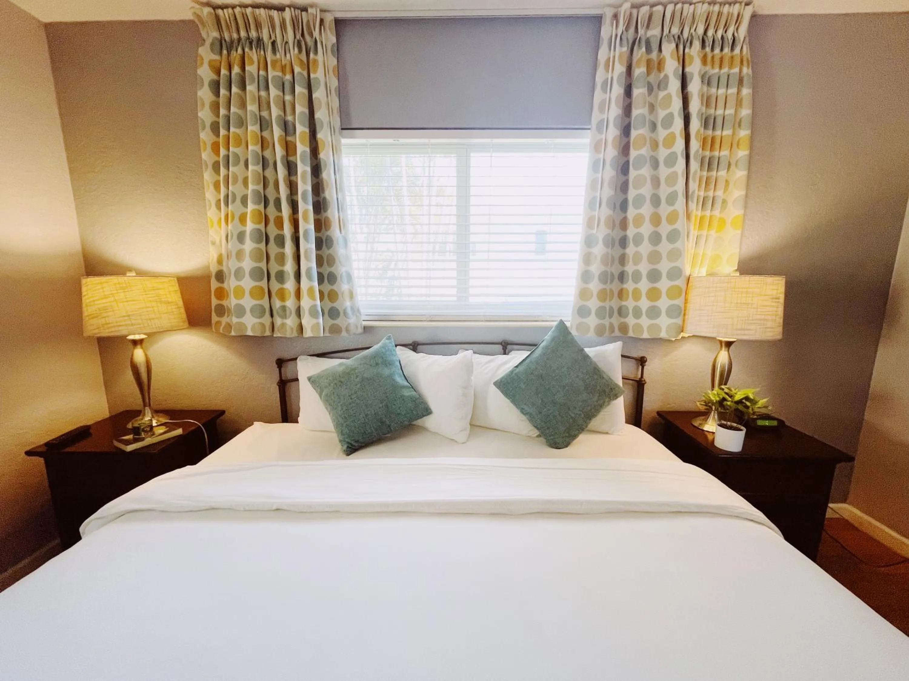 Bed in Great Escape Apartments By Lowkl