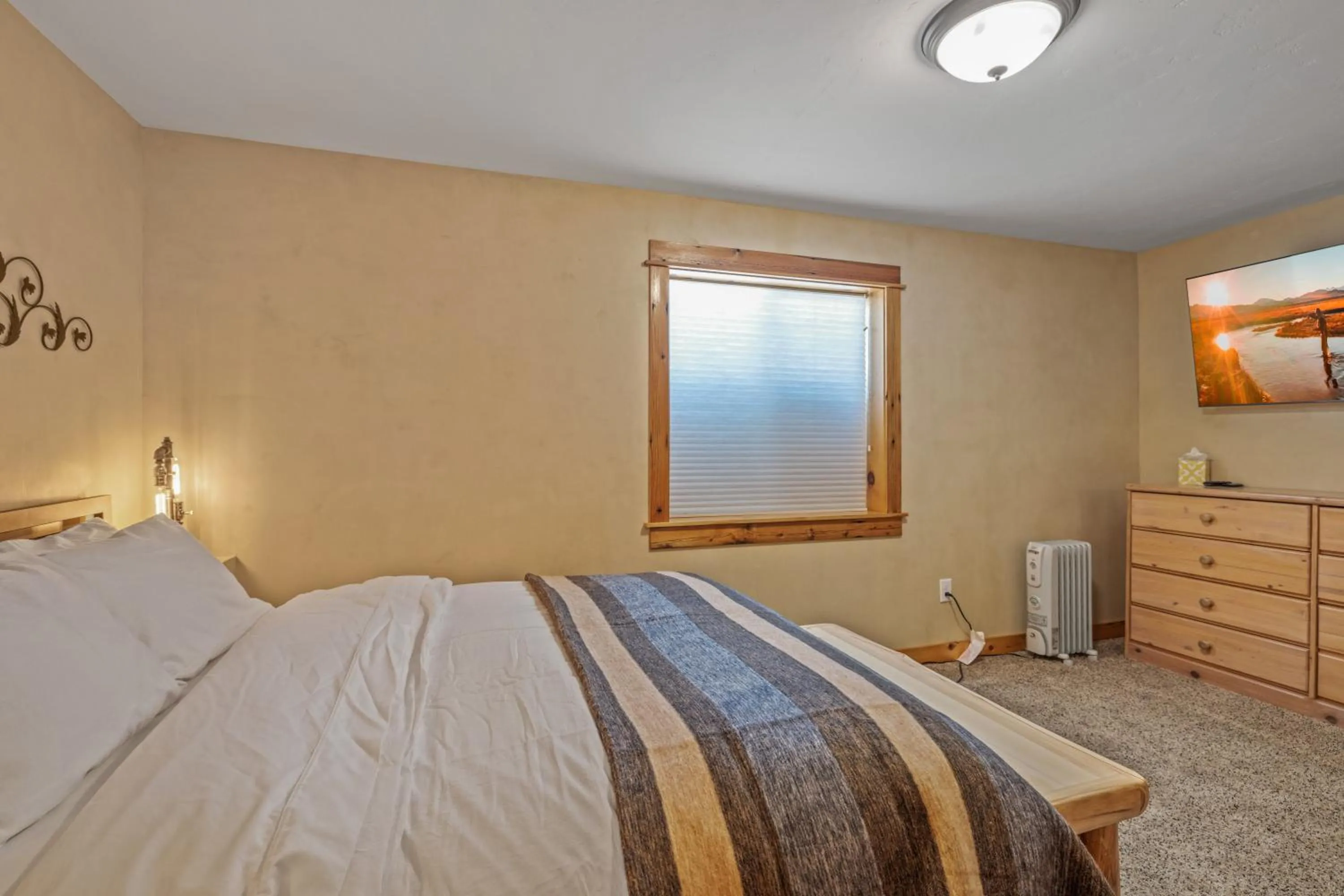 Bed in Liberty Lodge by KABINO Hot Tub Air Hockey 3 Living Rooms 7 bedrooms Boat Launch Reservoir ATV Snowmobile Trails WiFi