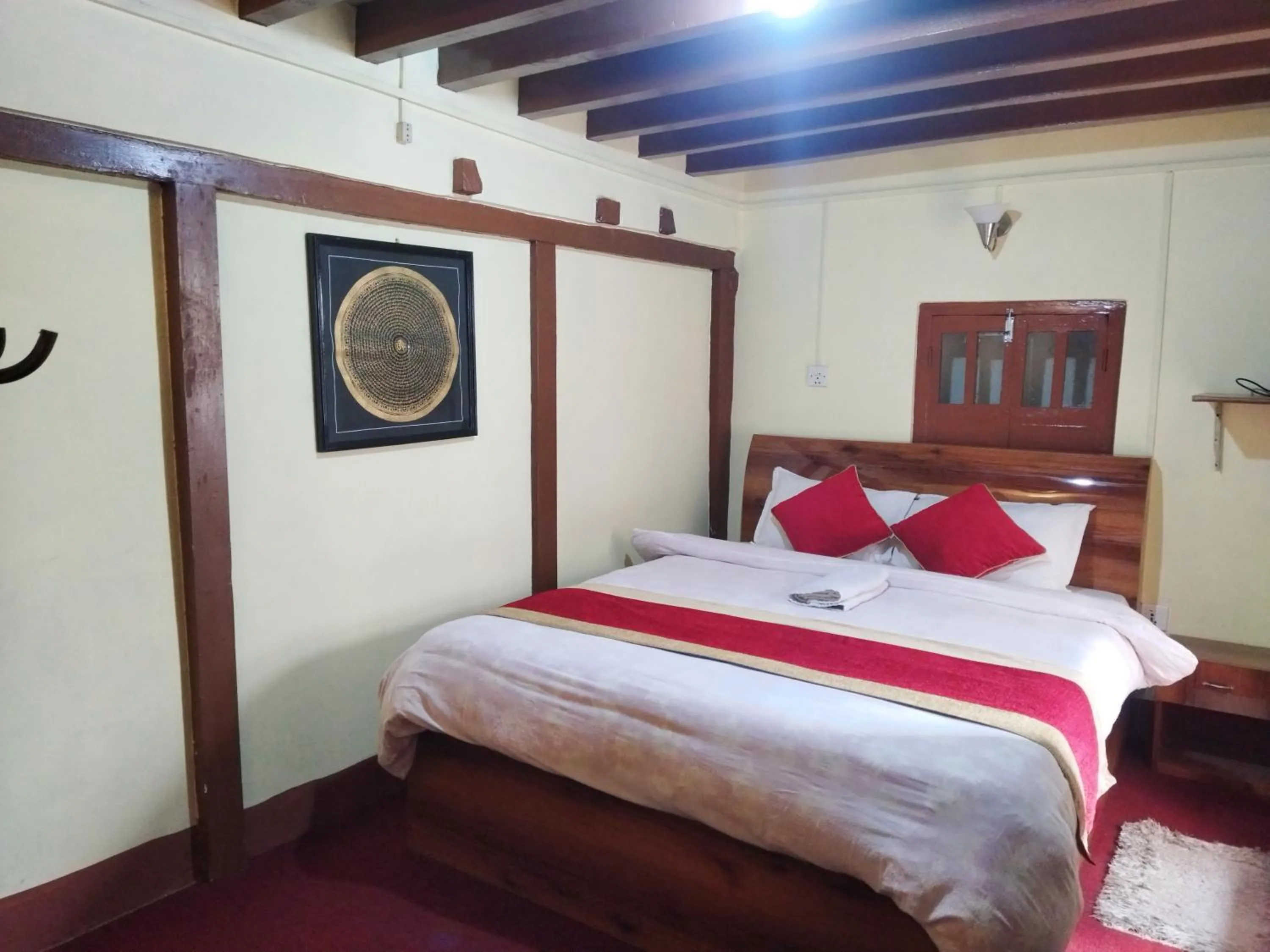 Bed in HOTEL RUPAKOT AND ROOFTOP RESTAURANT