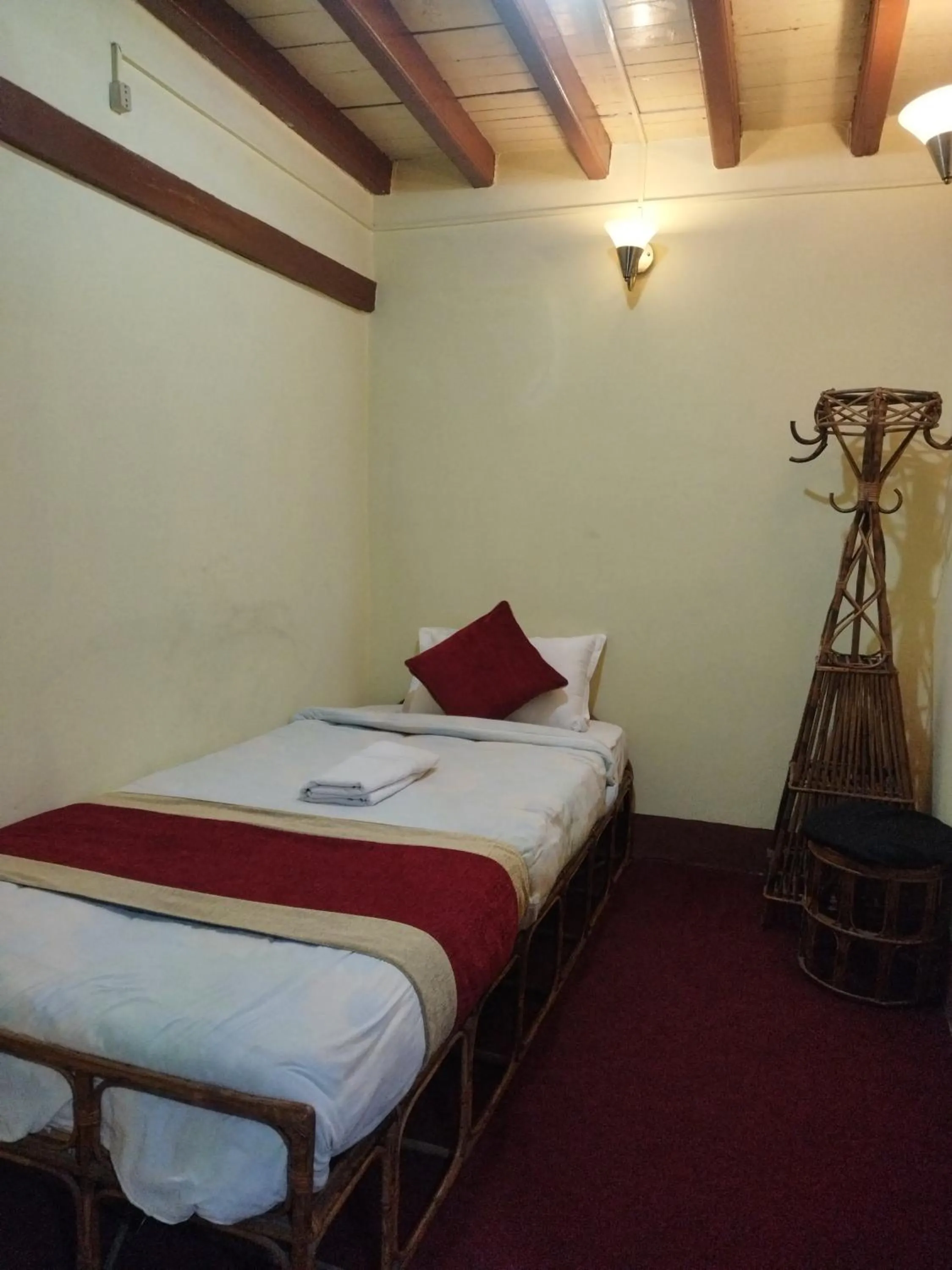 Bed in HOTEL RUPAKOT AND ROOFTOP RESTAURANT