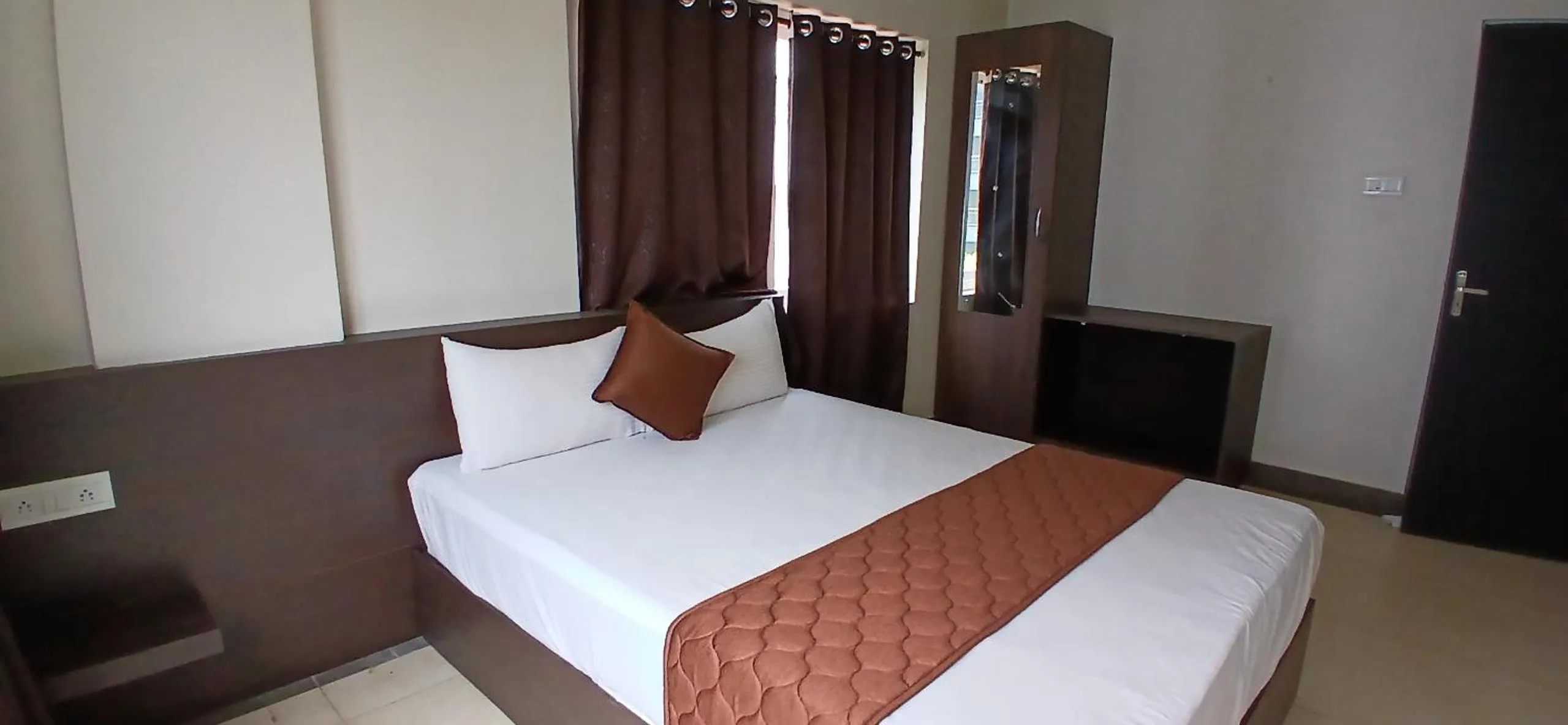Bed in HOTEL PANKAJ RESIDENCY