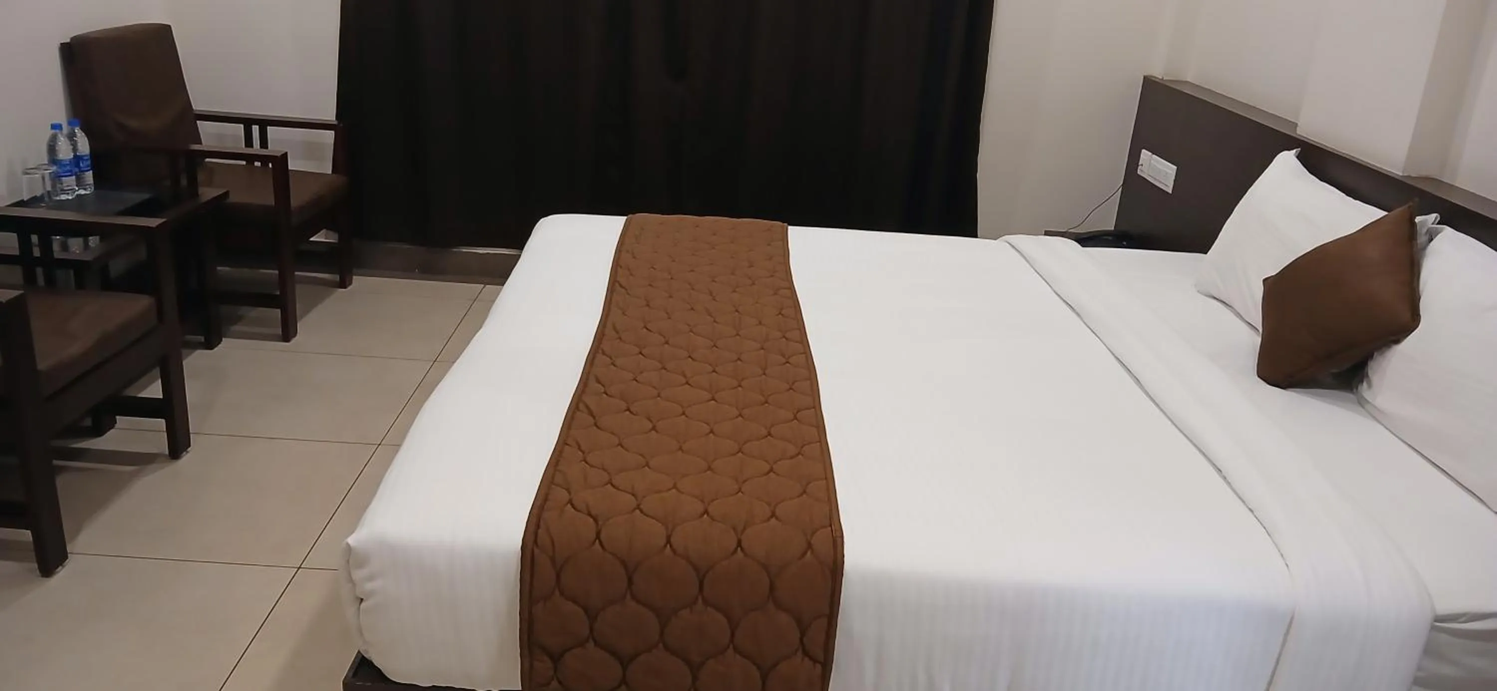 Bed in HOTEL PANKAJ RESIDENCY
