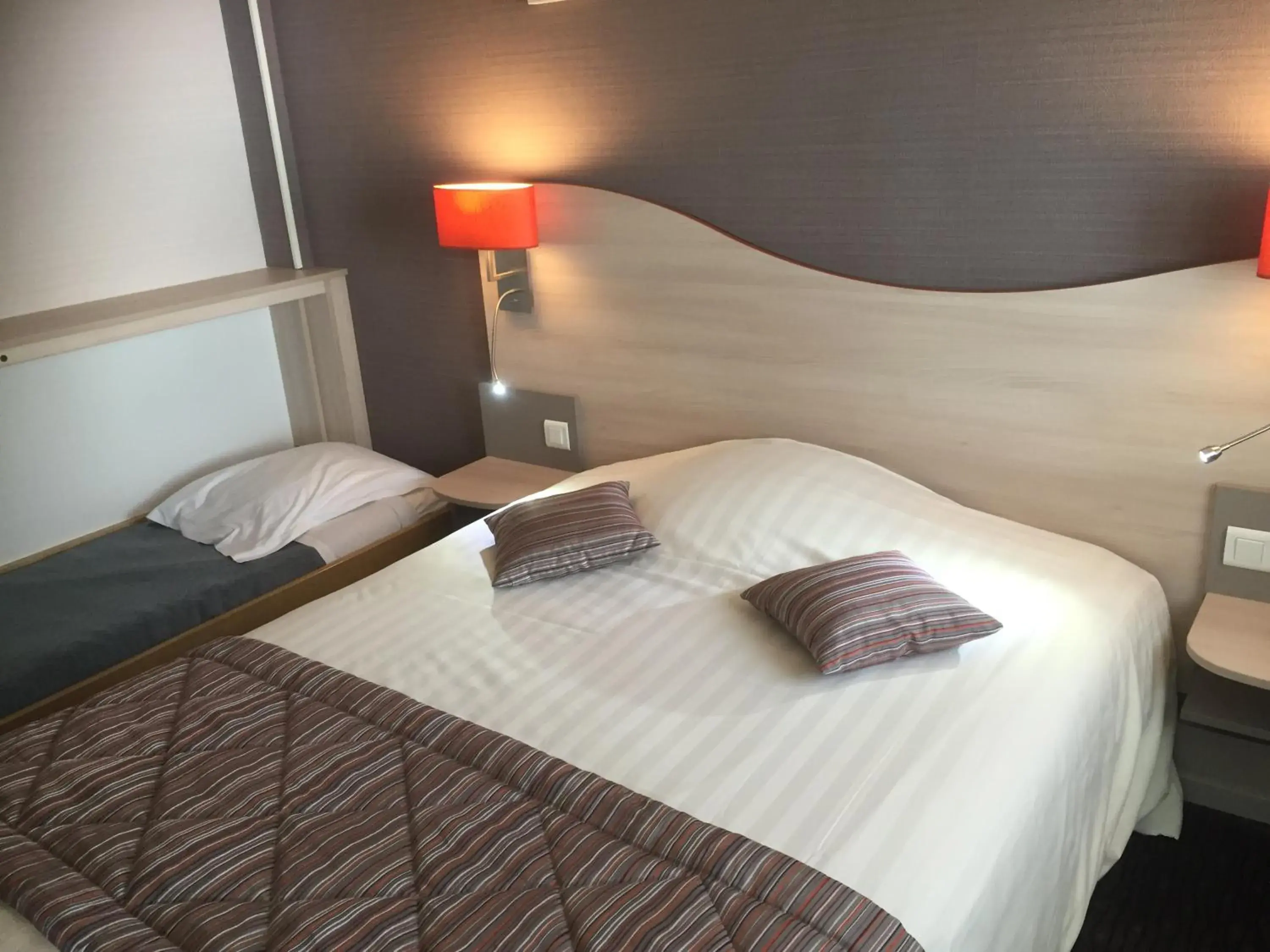 Bed in Logis Hôtel Au Tambour Bed in Logis Hôtel Au Tambour