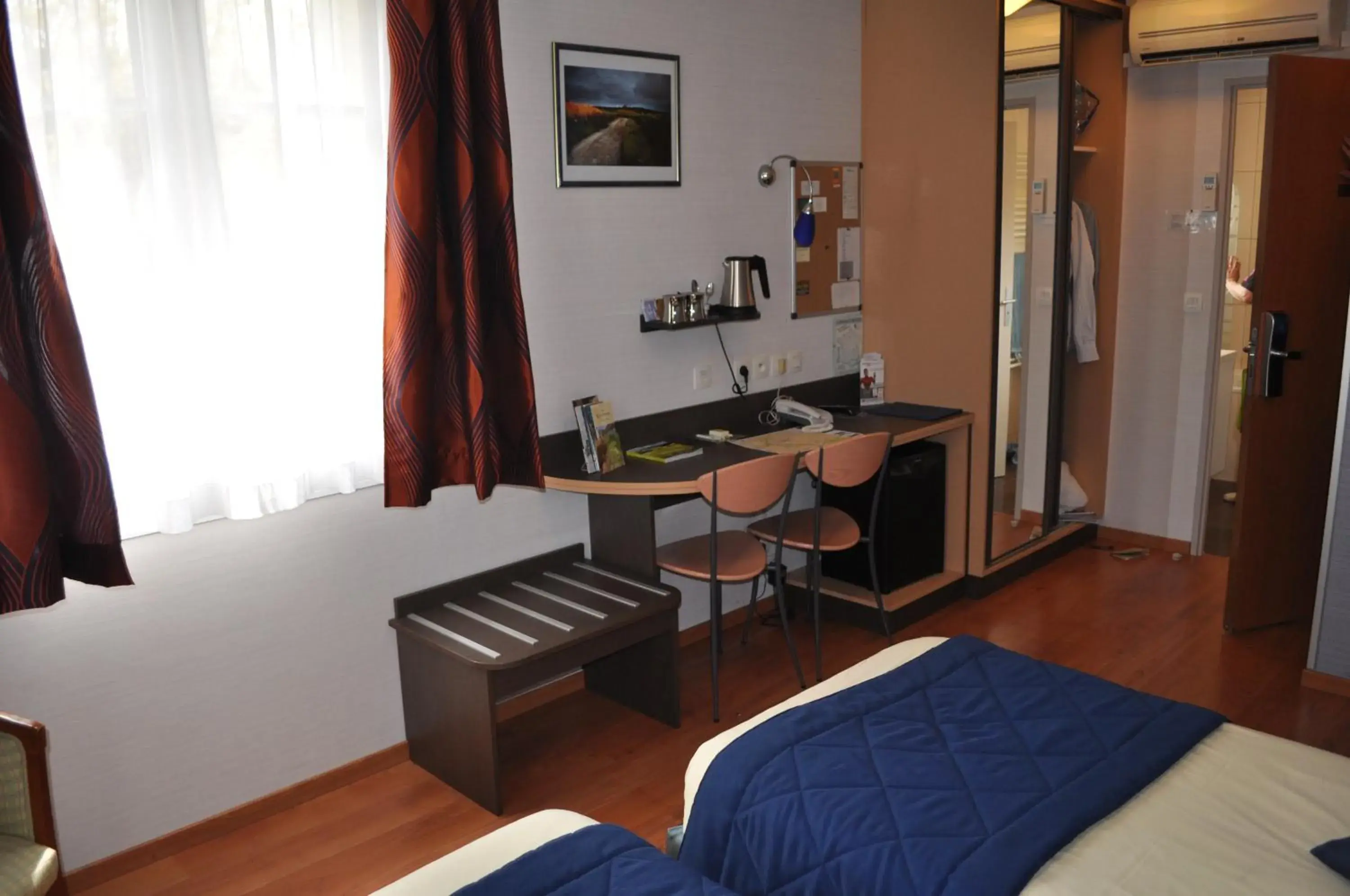 Bed in Logis Hôtel Au Tambour Bed in Logis Hôtel Au Tambour