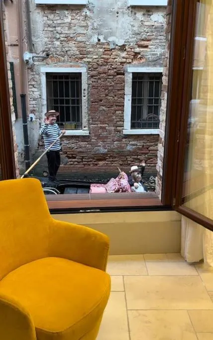 People in Dream's door with canal view in Venice