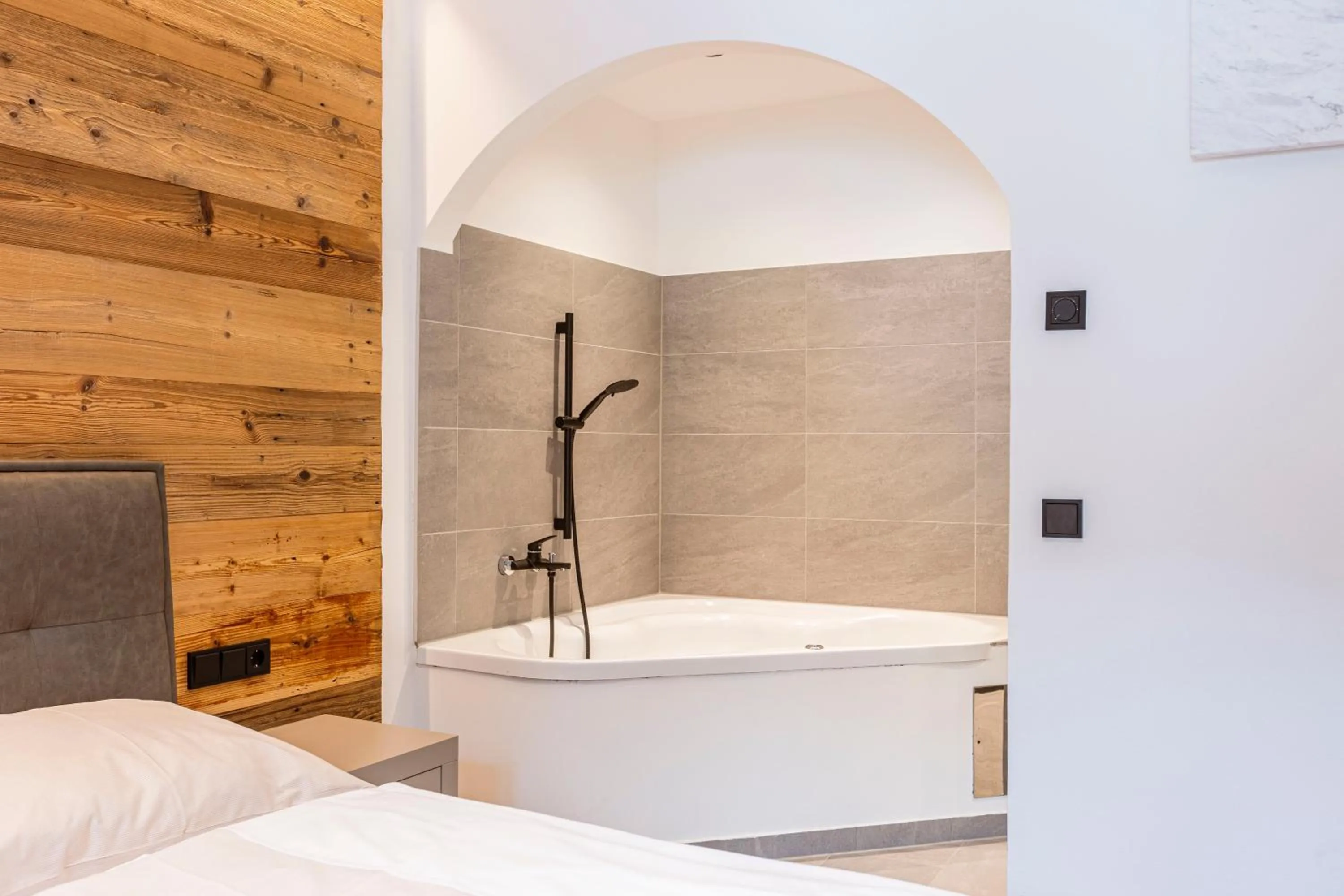 Bathroom, Bed in Saalbach Suites by ALPS RESORTS