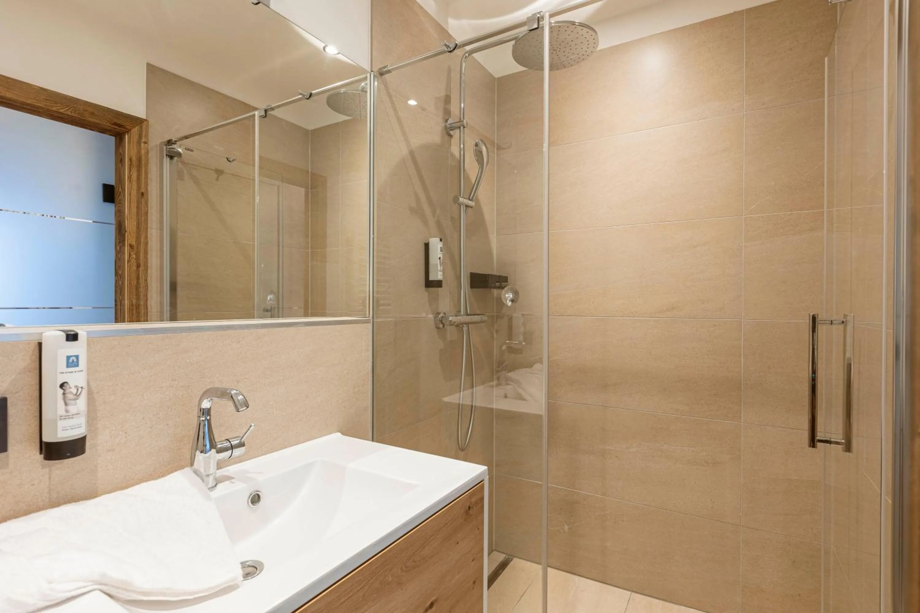 Bathroom in Saalbach Suites by ALPS RESORTS