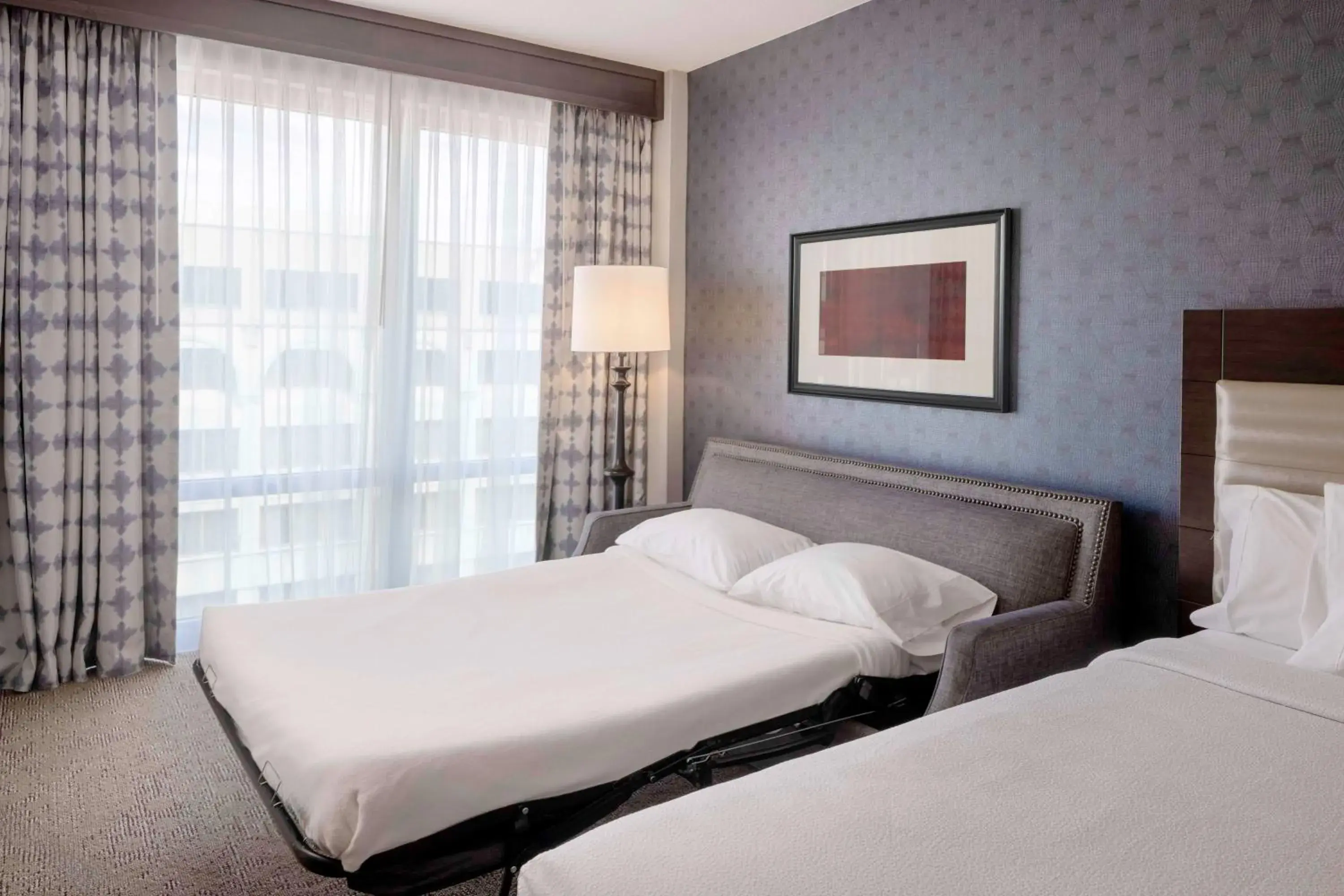 Deluxe Queen Room with Two Queen Beds and Sofa Bed in Hilton Garden Inn Washington DC/Georgetown Area Deluxe Queen Room with Two Queen Beds and Sofa Bed in Hilton Garden Inn Washington DC/Georgetown Area