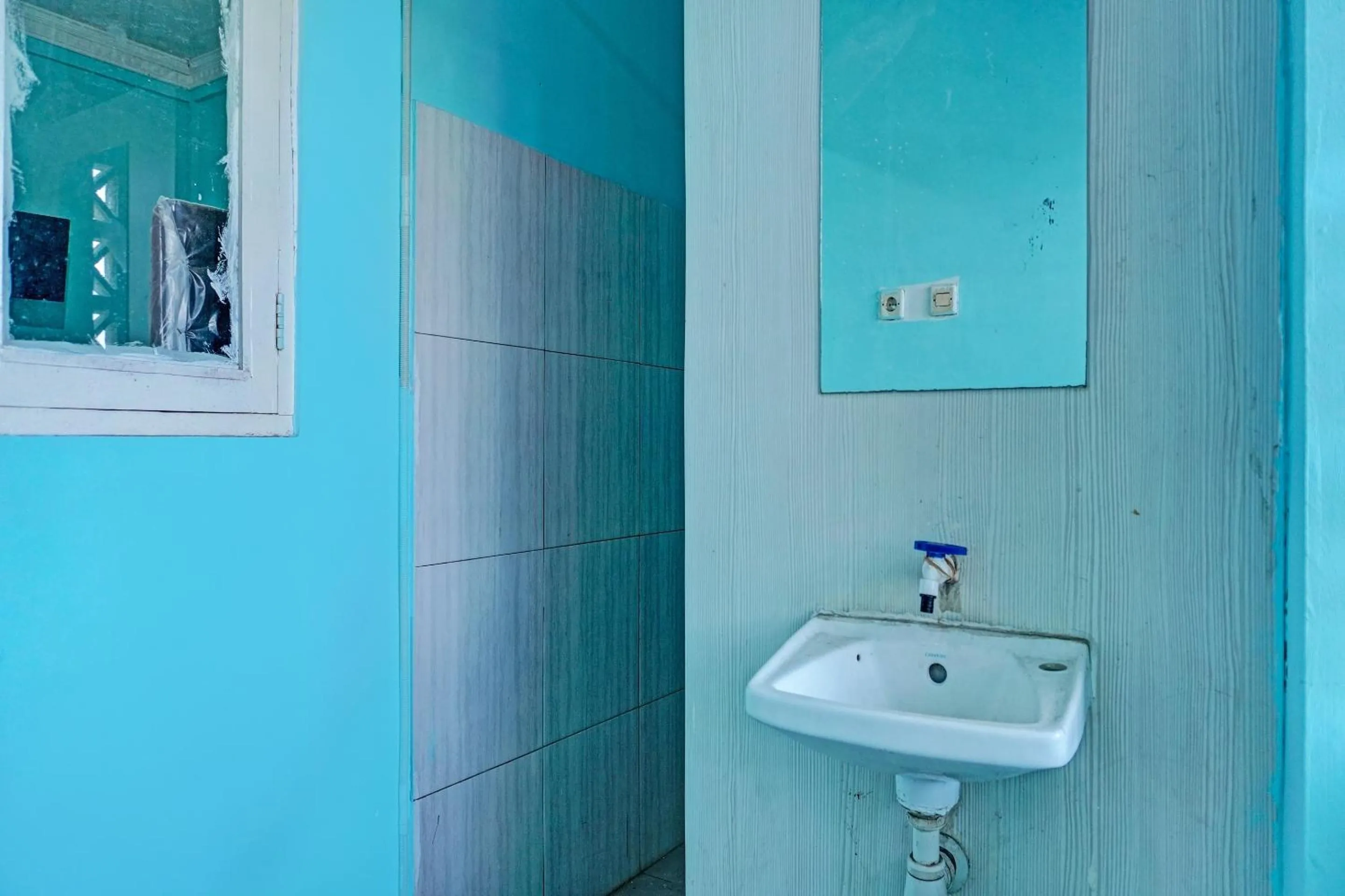 Bathroom in Hotel O Home Stay Elis Cateliya Syariah