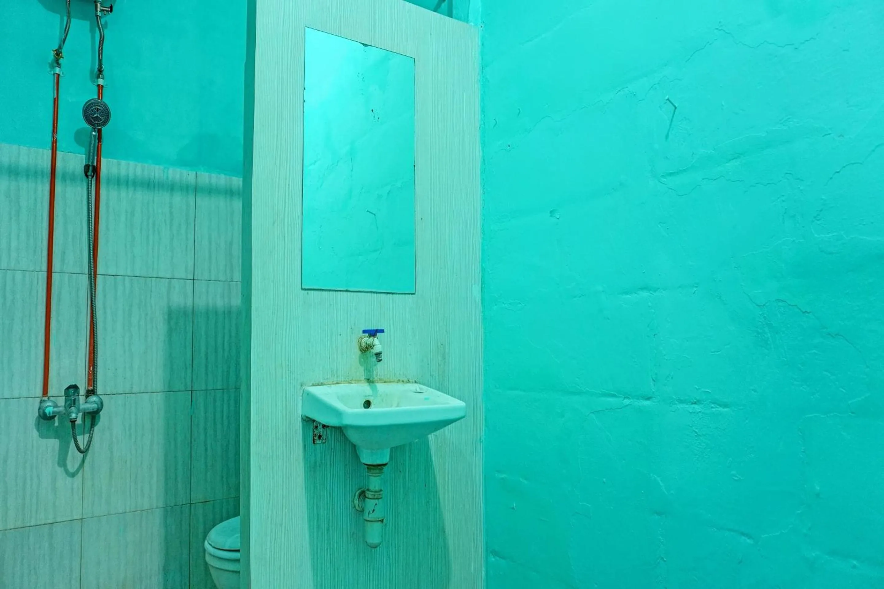 Bathroom in Hotel O Home Stay Elis Cateliya Syariah