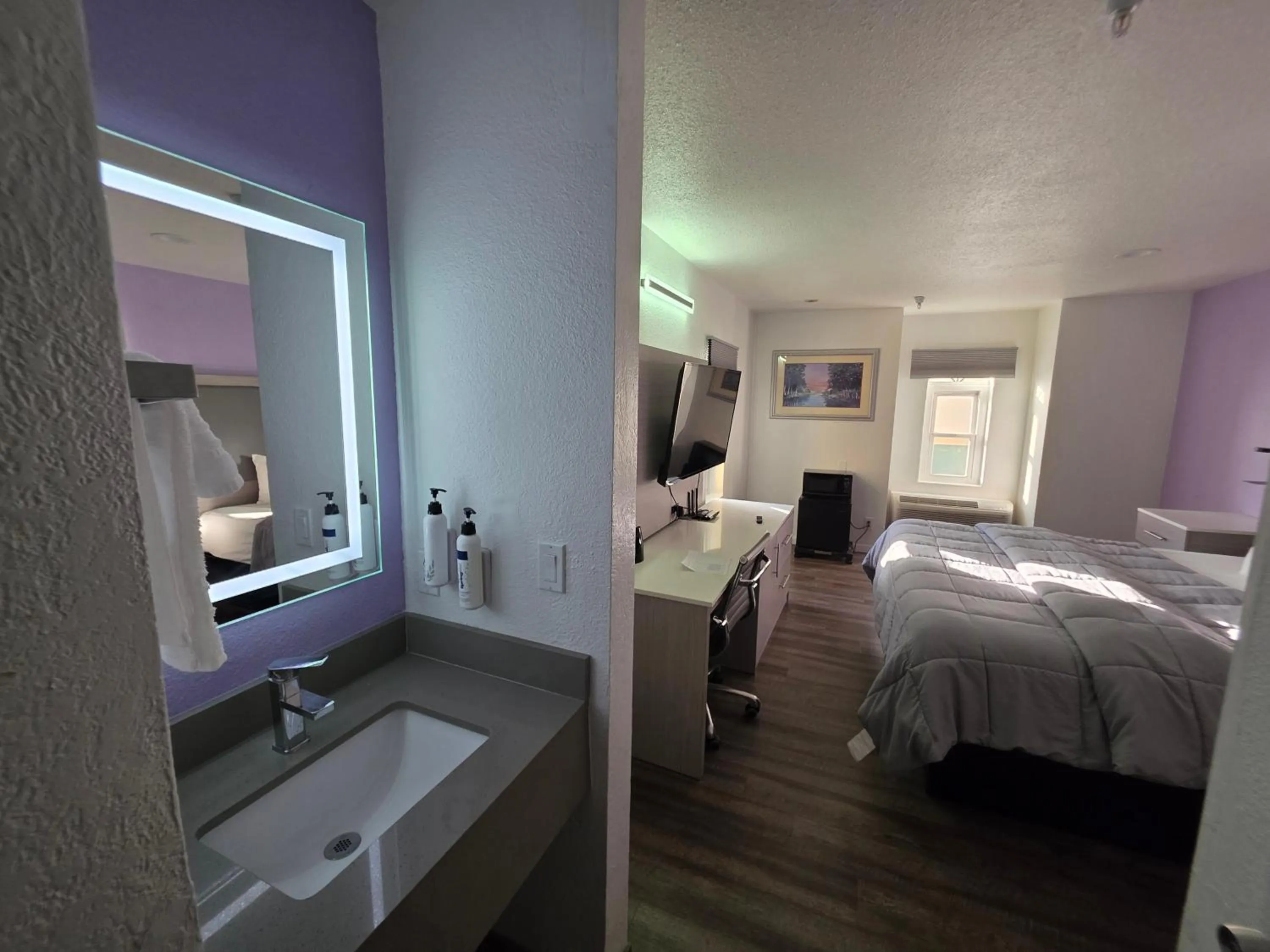 Photo of the whole room, Bed in The Aqua Pacific Hotel