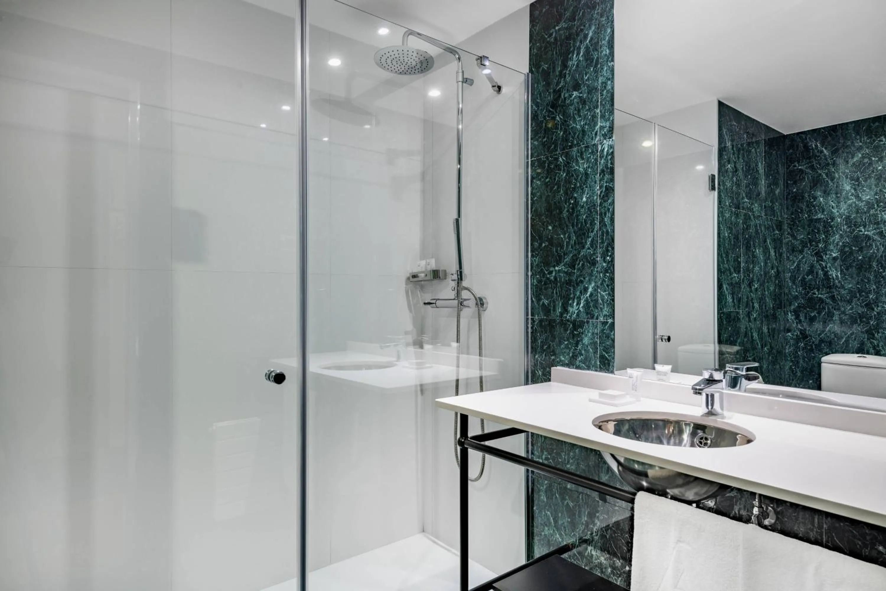 Bathroom in AC Hotel Avenida de América by Marriott