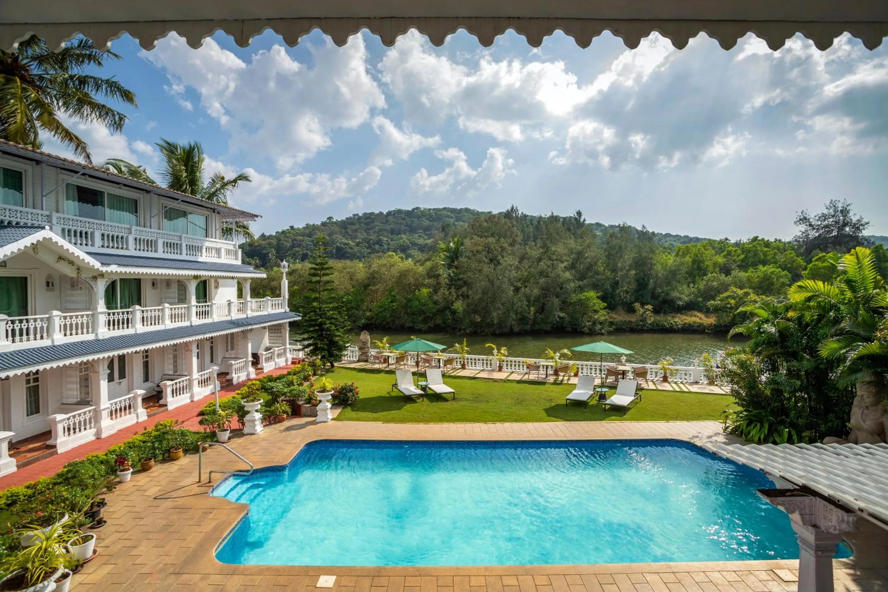 Pool view in Stone Wood Riverfront Resort, Siolim